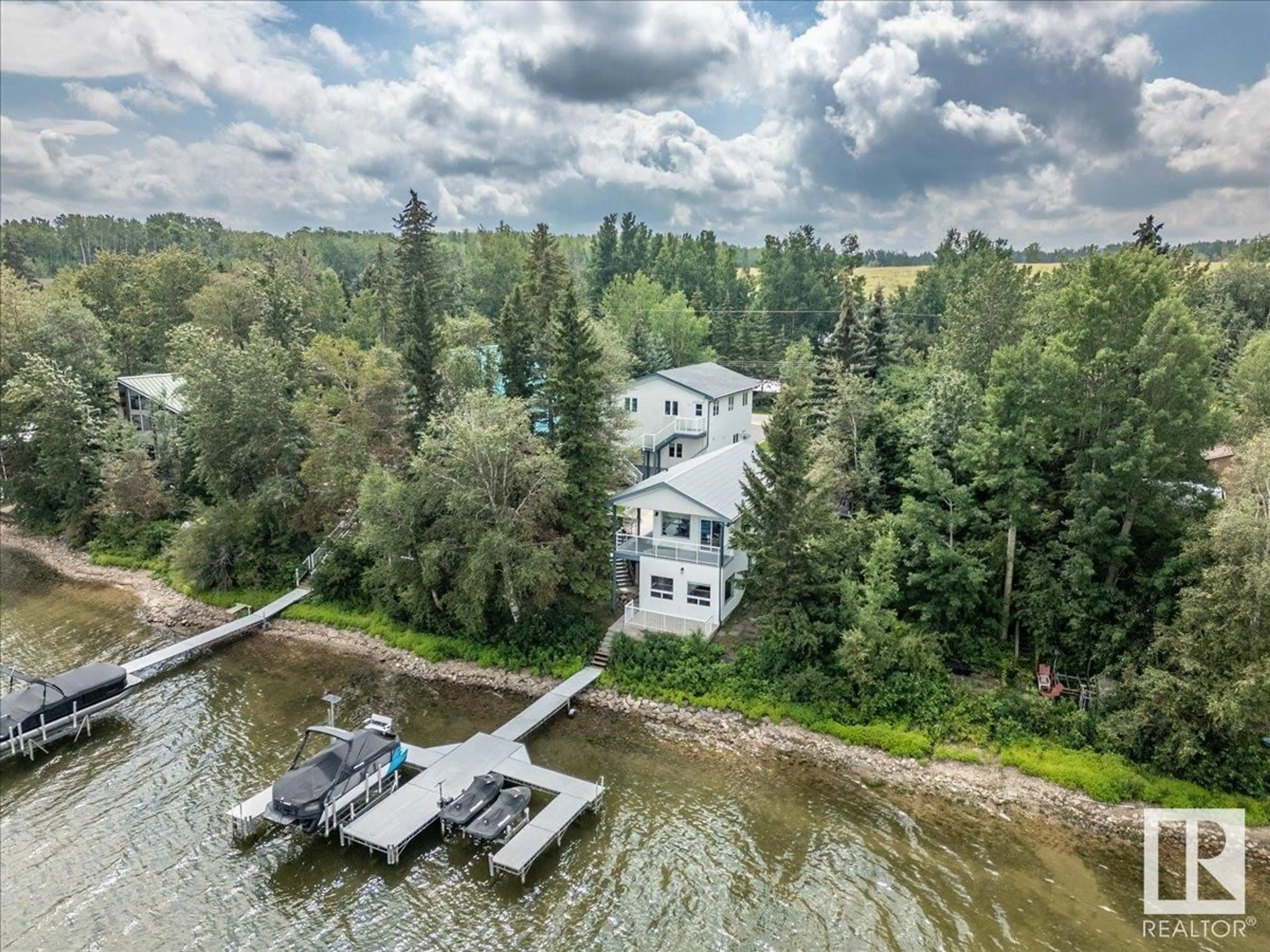 A pic from outside/outdoor area/front of a property/back of a property/a pic from drone, water/lake/river/ocean view for 239 LAKESHORE DR, Rural Wetaskiwin County Alberta T0C2V0