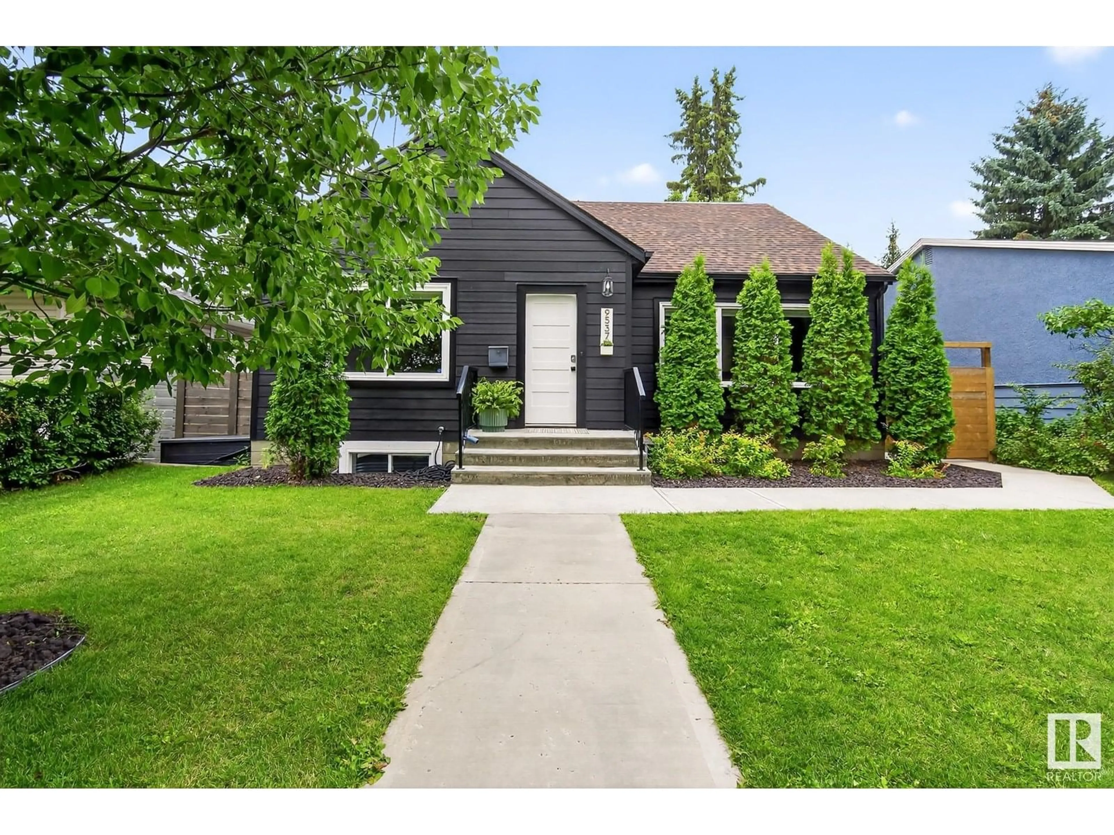 Home with vinyl exterior material, street for 9537 83 ST, Edmonton Alberta T6C2Z9