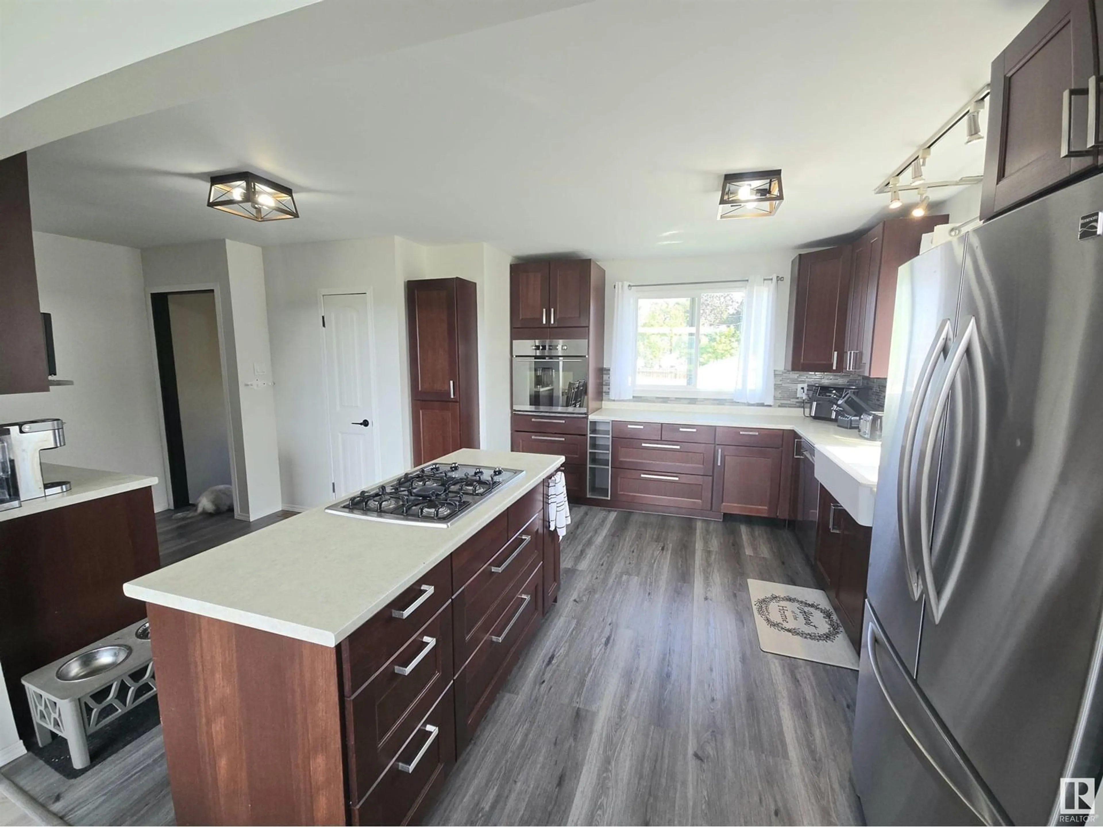 Open concept kitchen, wood/laminate floor for 4732 54 AV, Whitecourt Alberta T7S1A3