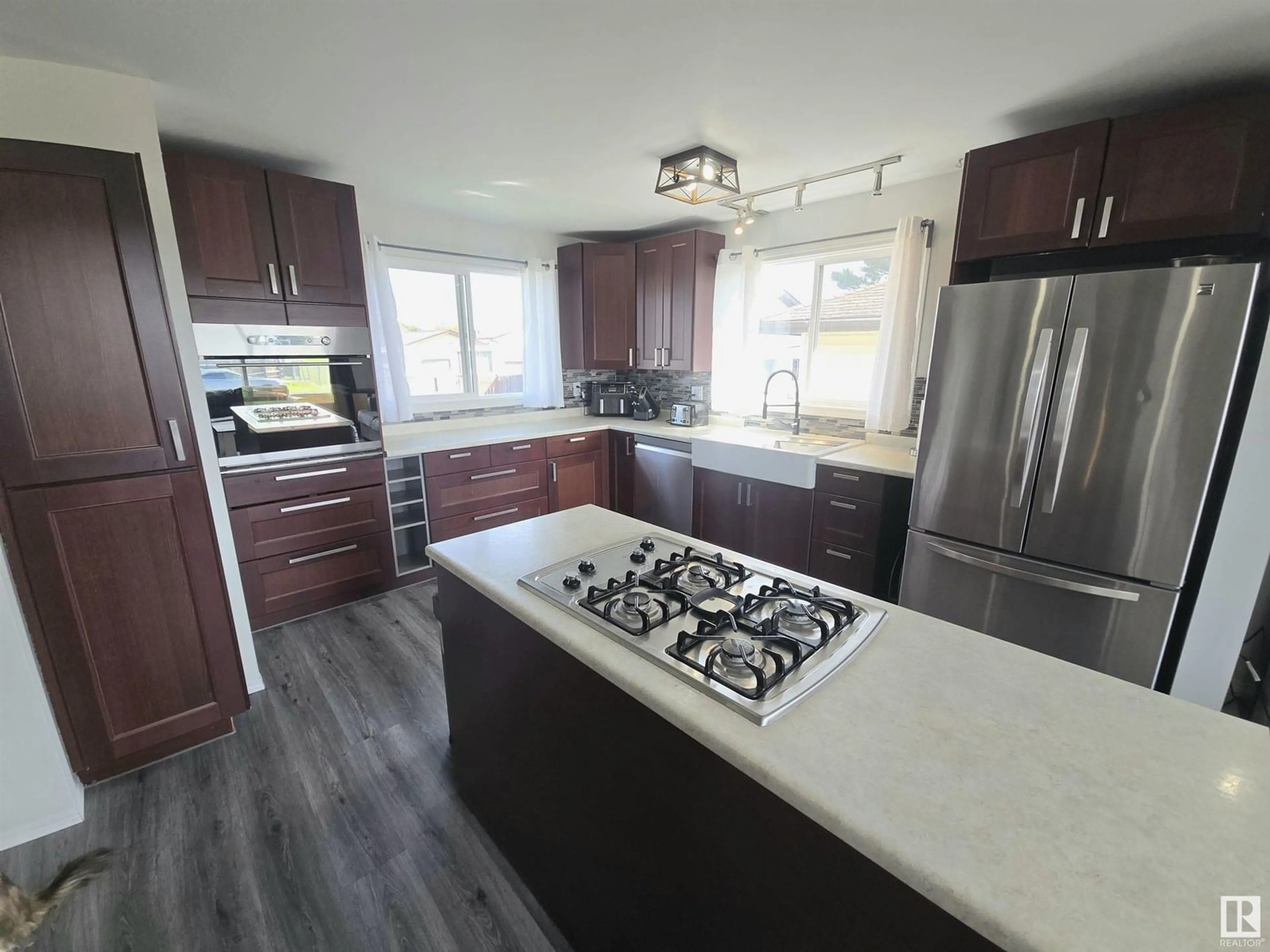 Open concept kitchen, wood/laminate floor for 4732 54 AV, Whitecourt Alberta T7S1A3