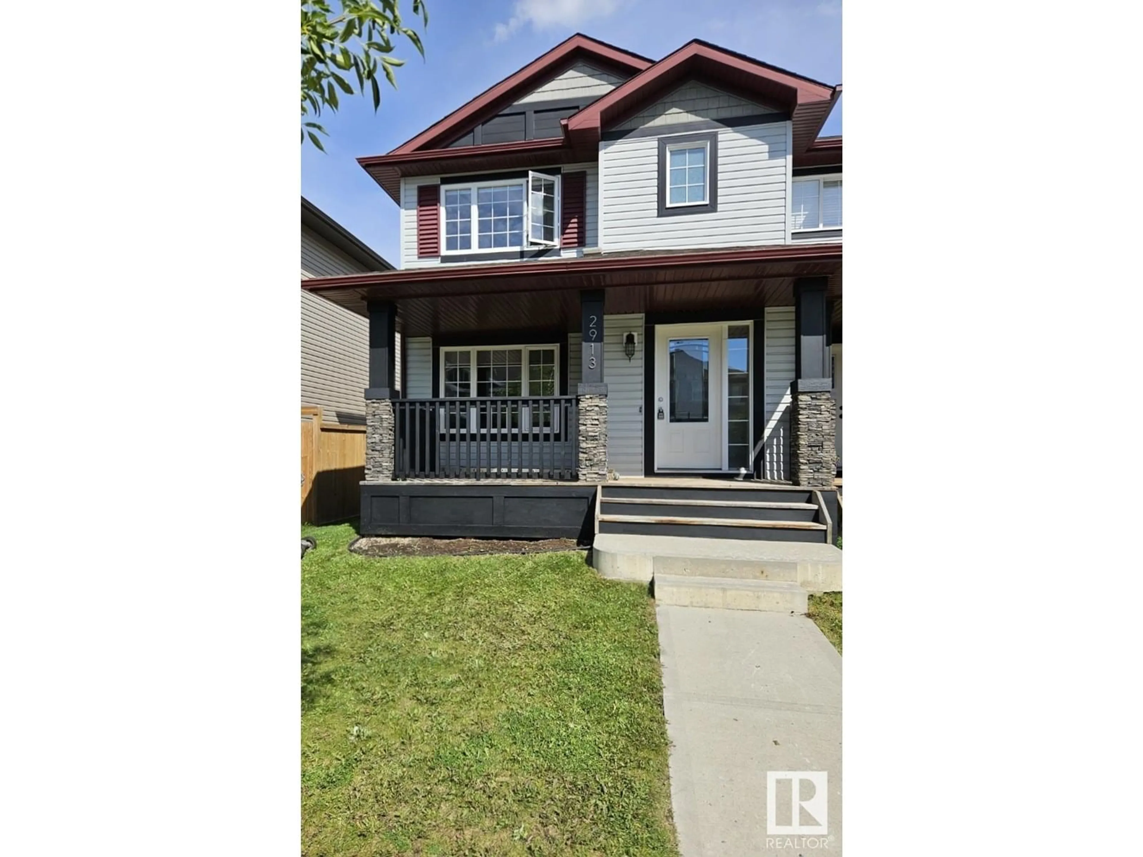 Home with vinyl exterior material, street for 2913 15 ST, Edmonton Alberta T6T0V6
