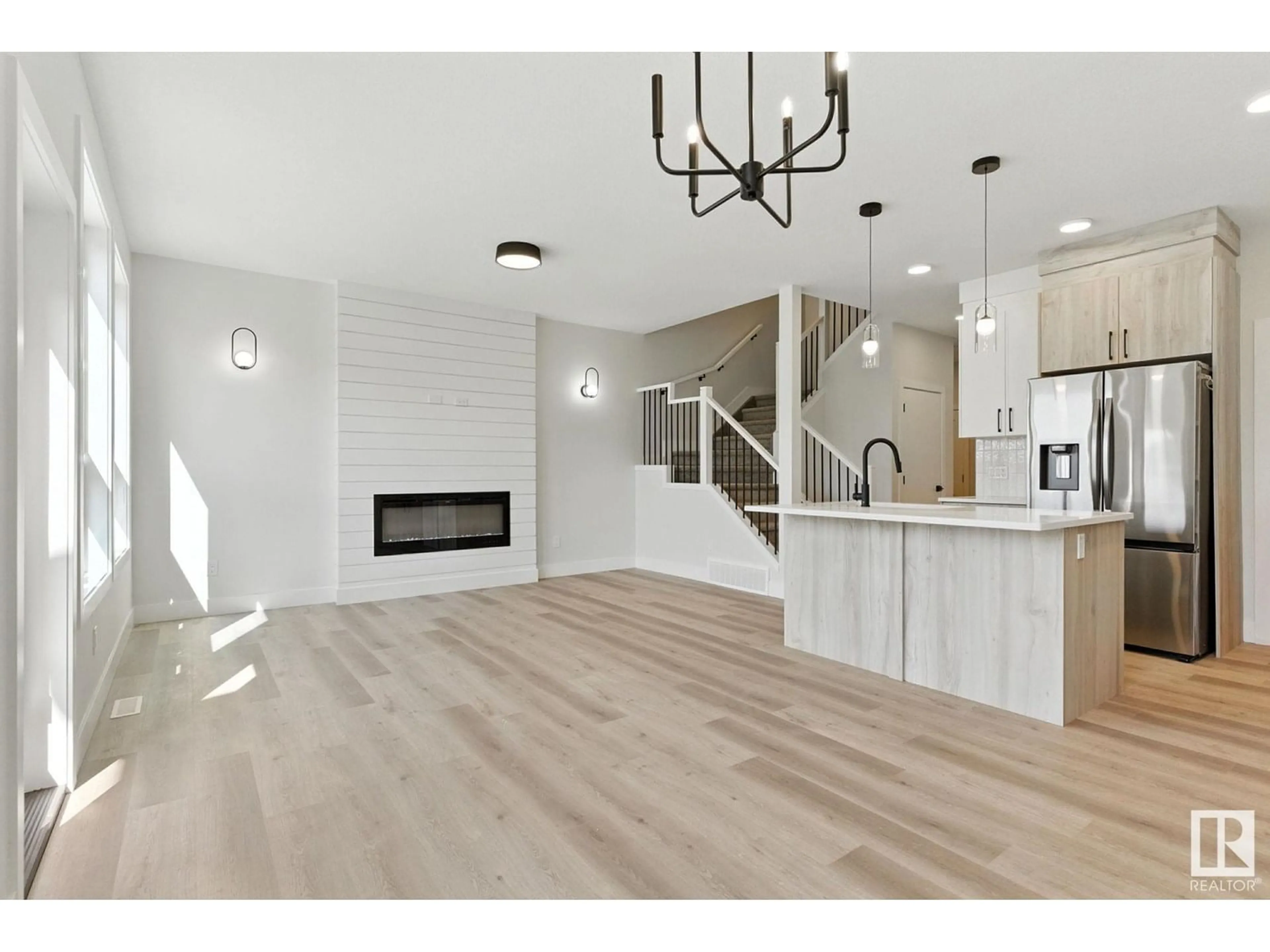 Open concept kitchen, wood/laminate floor for NW - 8831 181 AV, Edmonton Alberta T5Z0X4