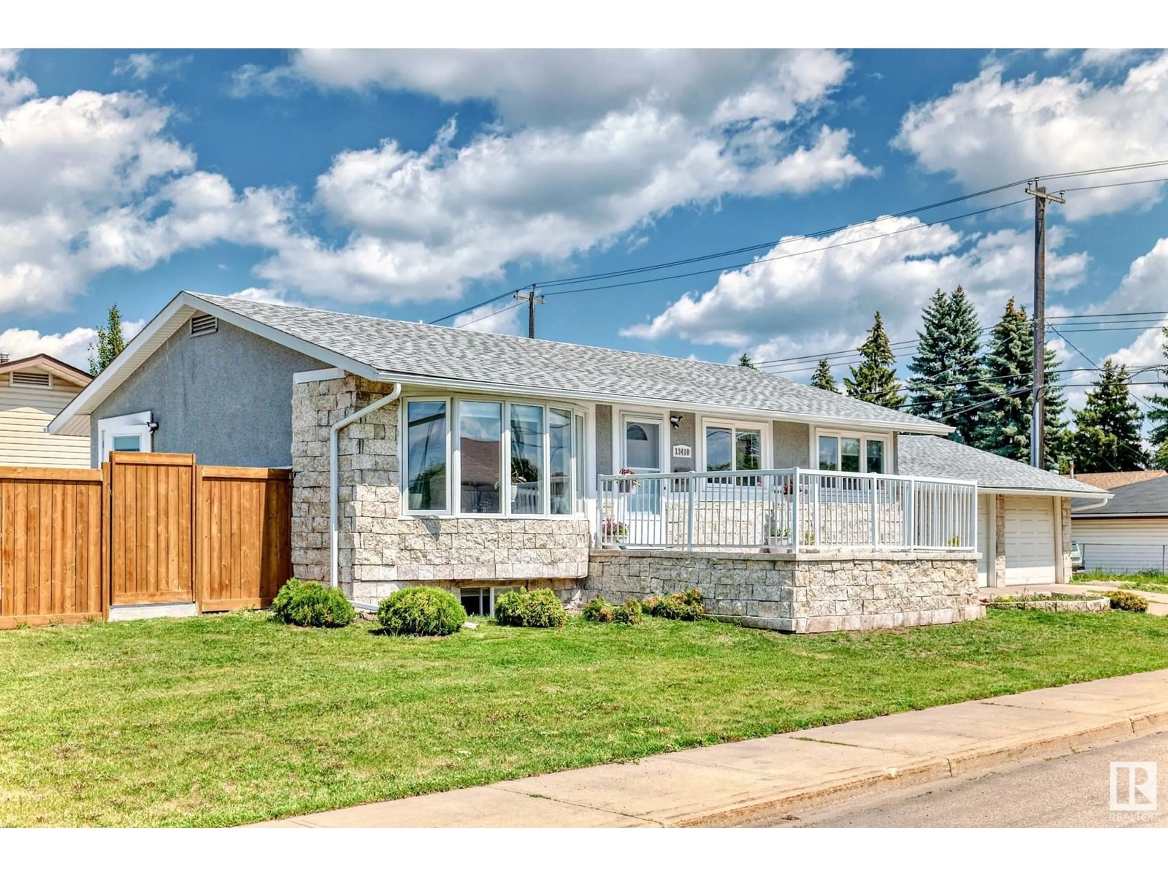 Home with vinyl exterior material, street for 13410 134 AV, Edmonton Alberta T5L3V9