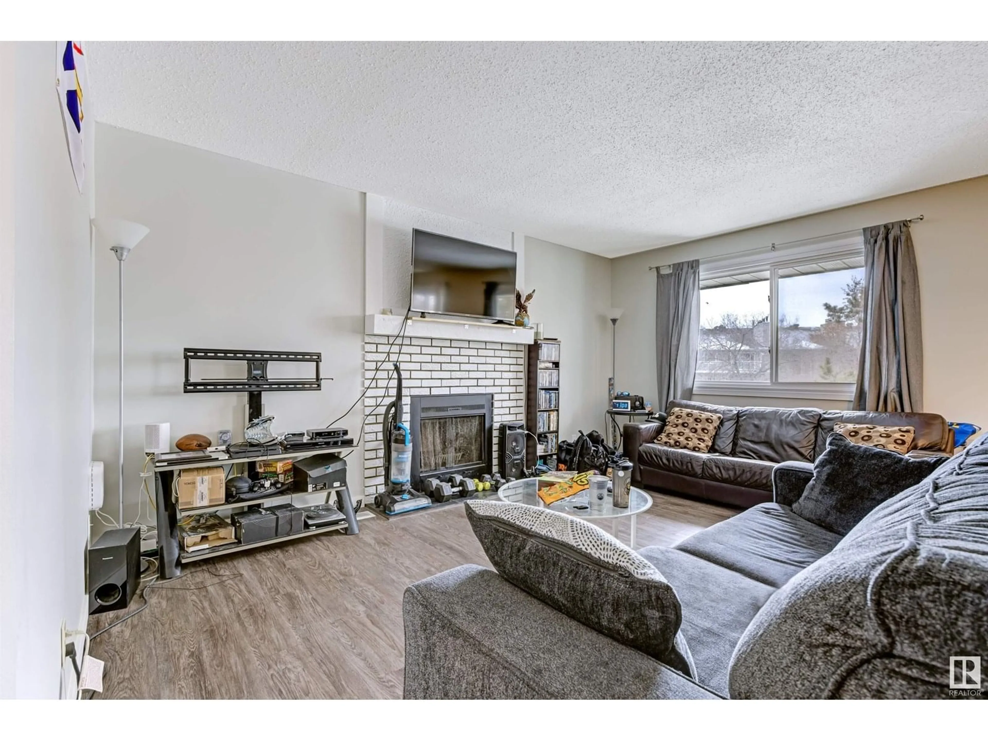 Living room with furniture, wood/laminate floor for #302 - 6204 180 ST, Edmonton Alberta T5T3J9