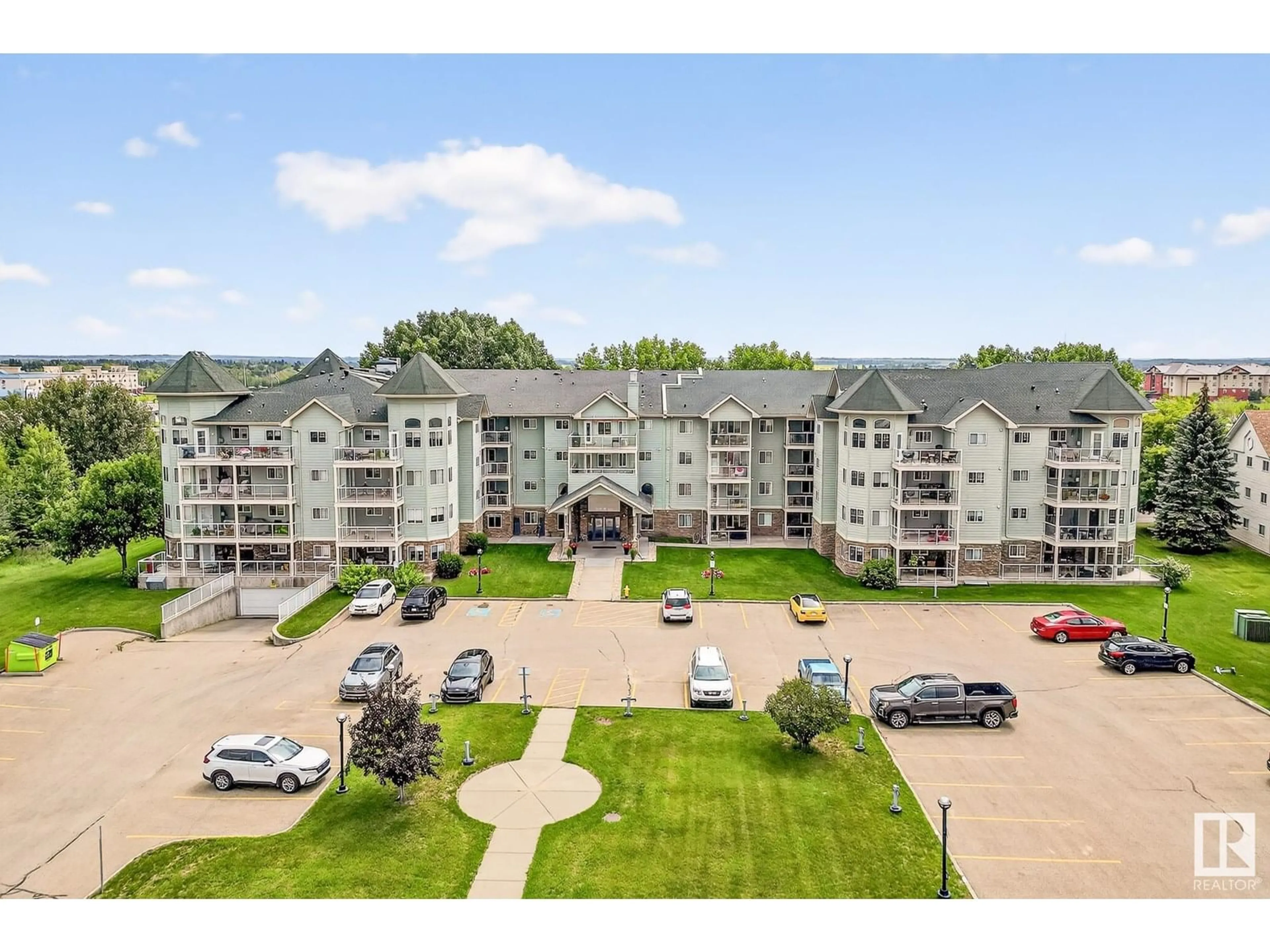 A pic from outside/outdoor area/front of a property/back of a property/a pic from drone, mountain view for 202 - 9995 93 AV, Fort Saskatchewan Alberta T8L1N5