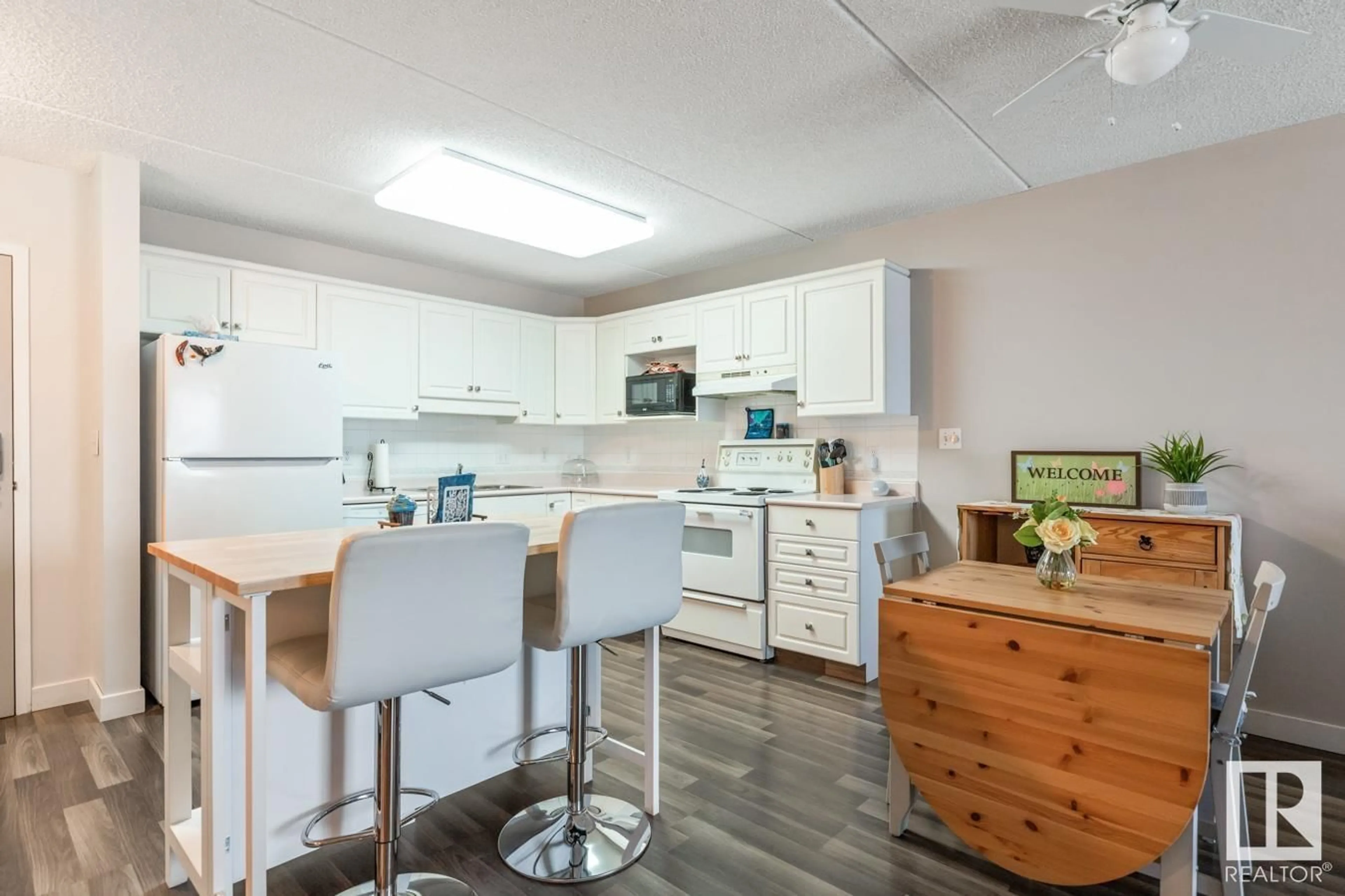 Open concept kitchen, wood/laminate floor for 202 - 4906 47 AV, Leduc Alberta T9E6R7
