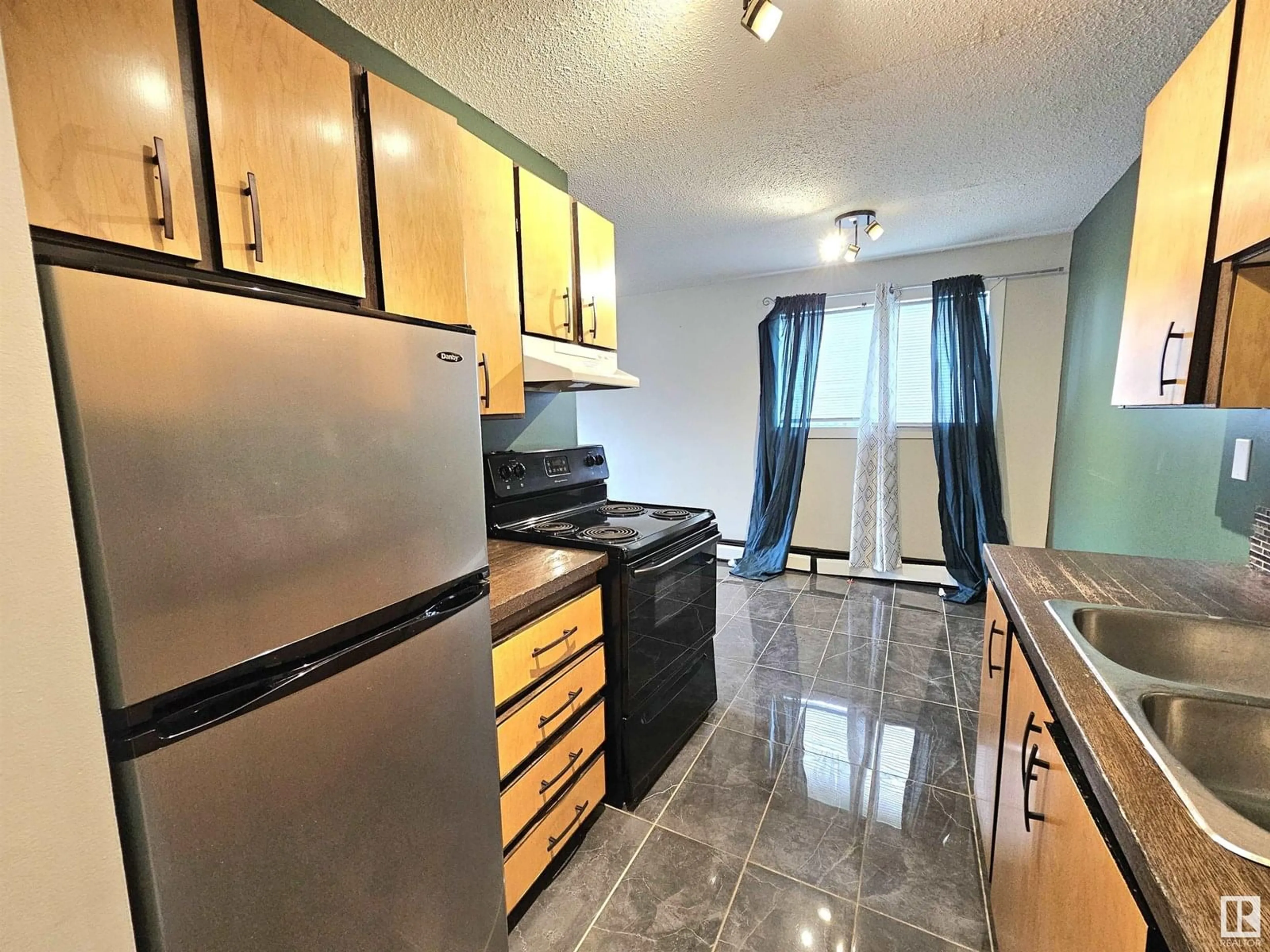 Standard kitchen, ceramic/tile floor for #101 - 12929 127 ST, Edmonton Alberta T5L1B1