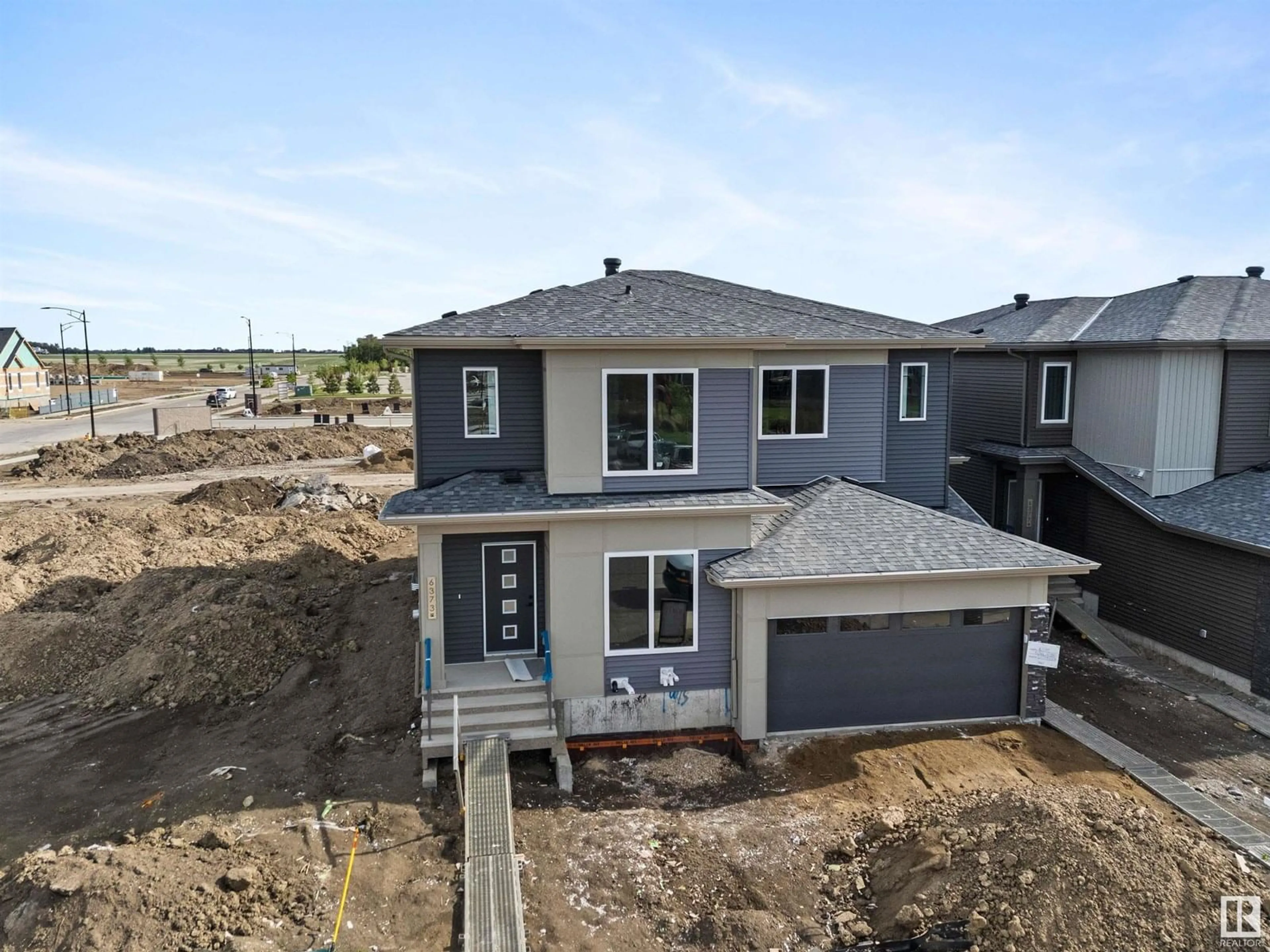 A pic from outside/outdoor area/front of a property/back of a property/a pic from drone, street for 6375 KING WD, Edmonton Alberta T6W5J3