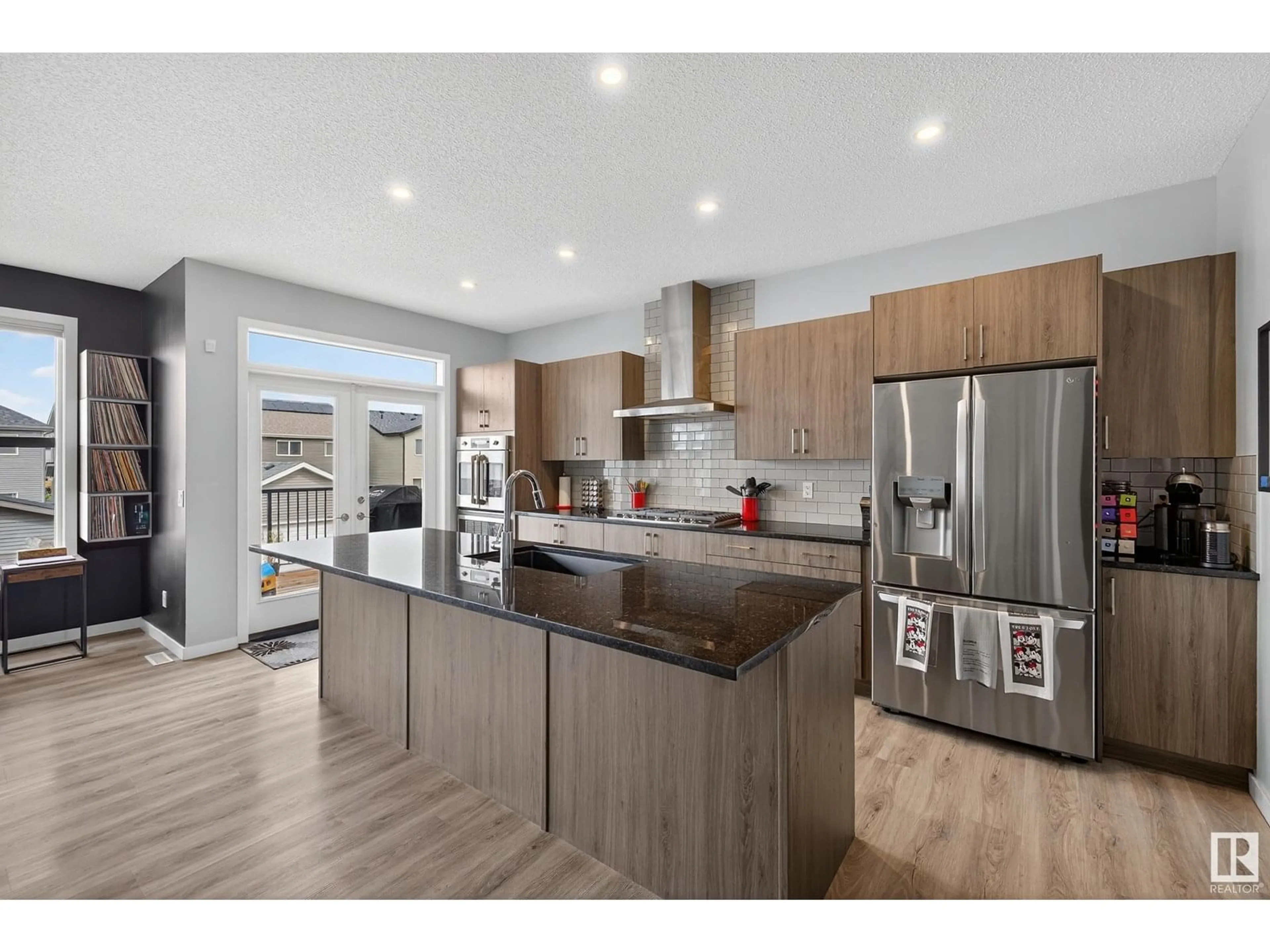 Open concept kitchen, wood/laminate floor for 1462 DARBY GREEN GR, Edmonton Alberta T6E2E7