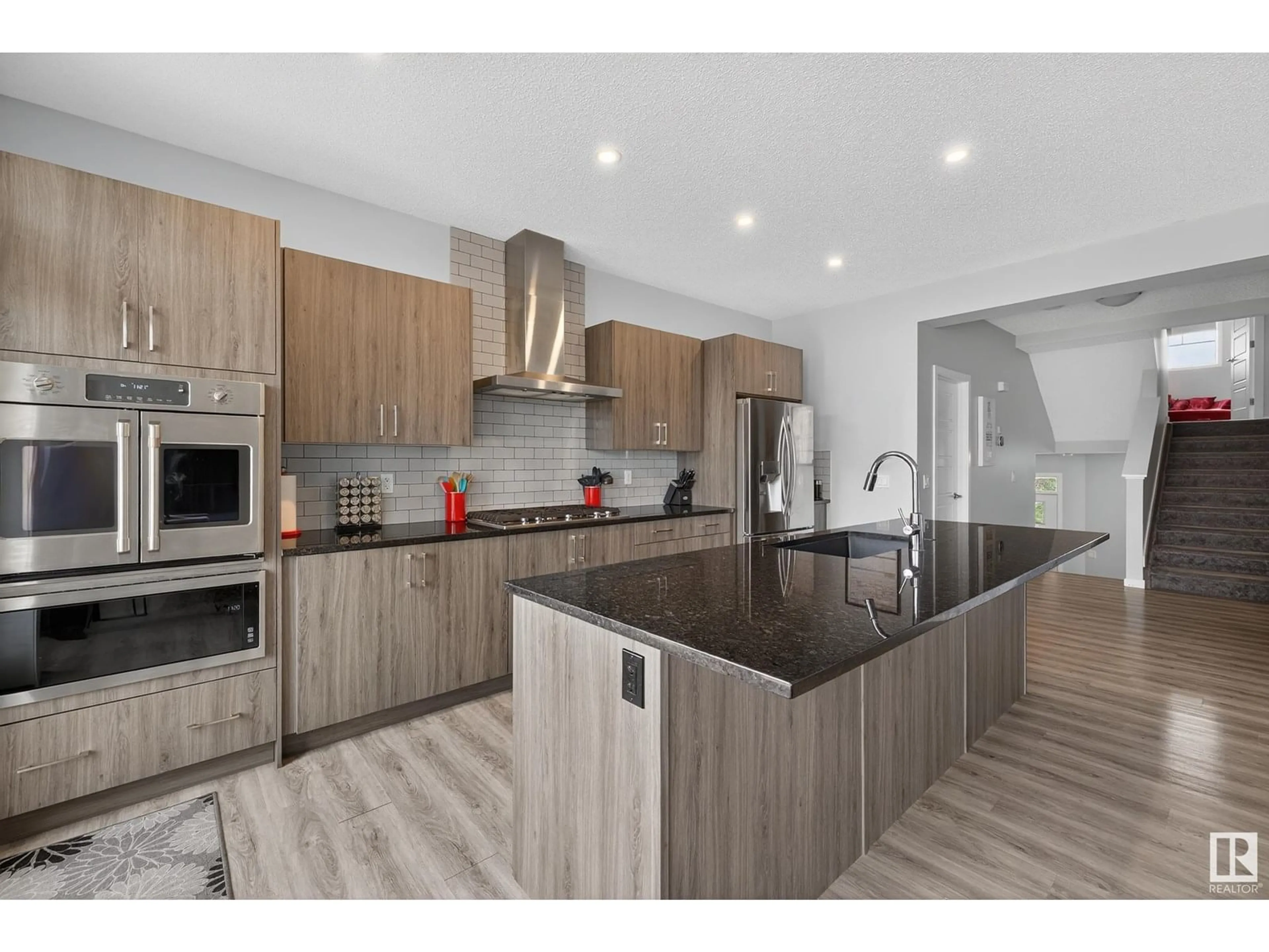 Open concept kitchen, wood/laminate floor for 1462 DARBY GREEN GR, Edmonton Alberta T6E2E7
