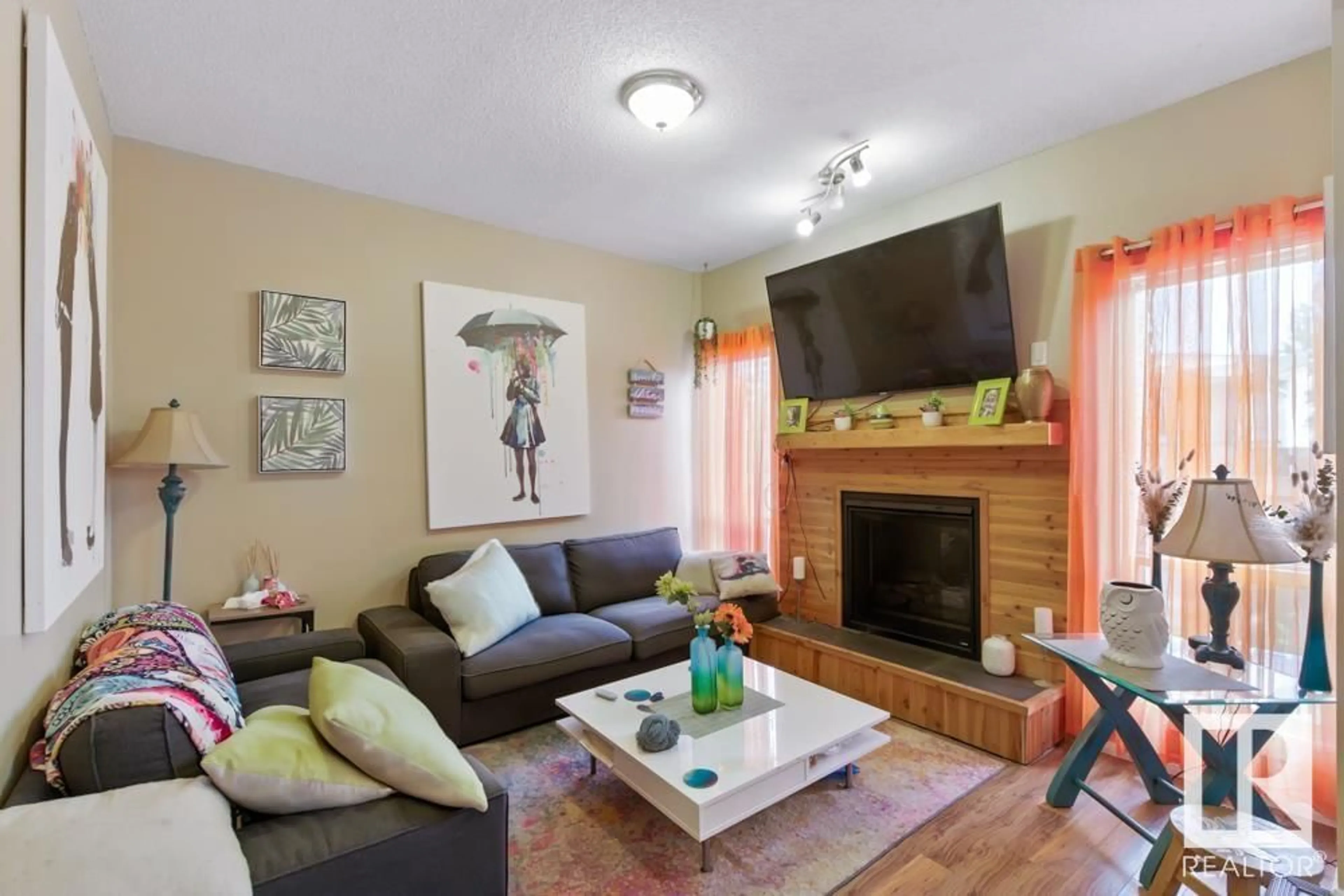 Living room with furniture, wood/laminate floor for #54 - 3812 20 AV, Edmonton Alberta T6L4B2