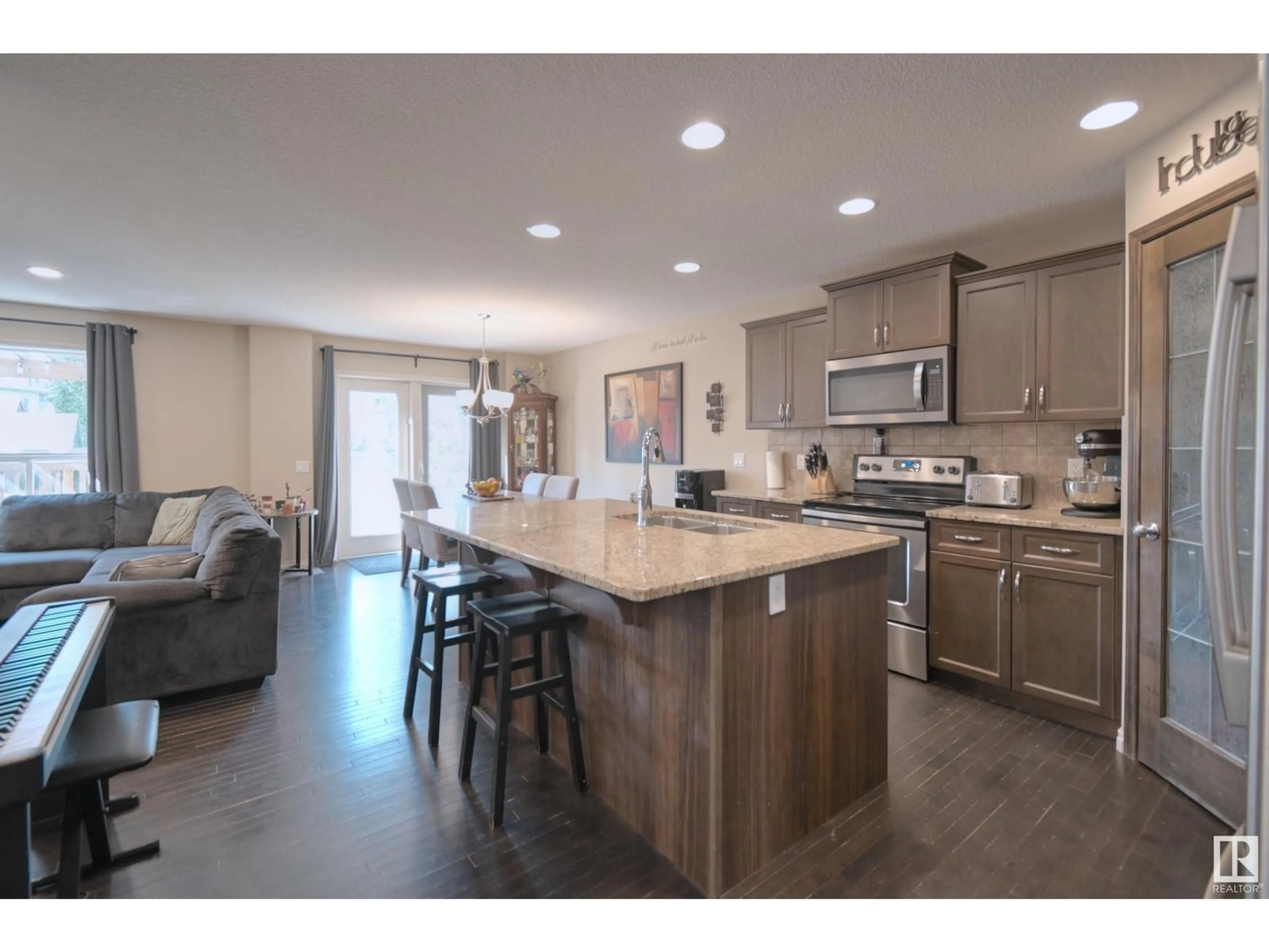 Open concept kitchen, wood/laminate floor for 67 AVONLEA WY, Spruce Grove Alberta T7X0H8