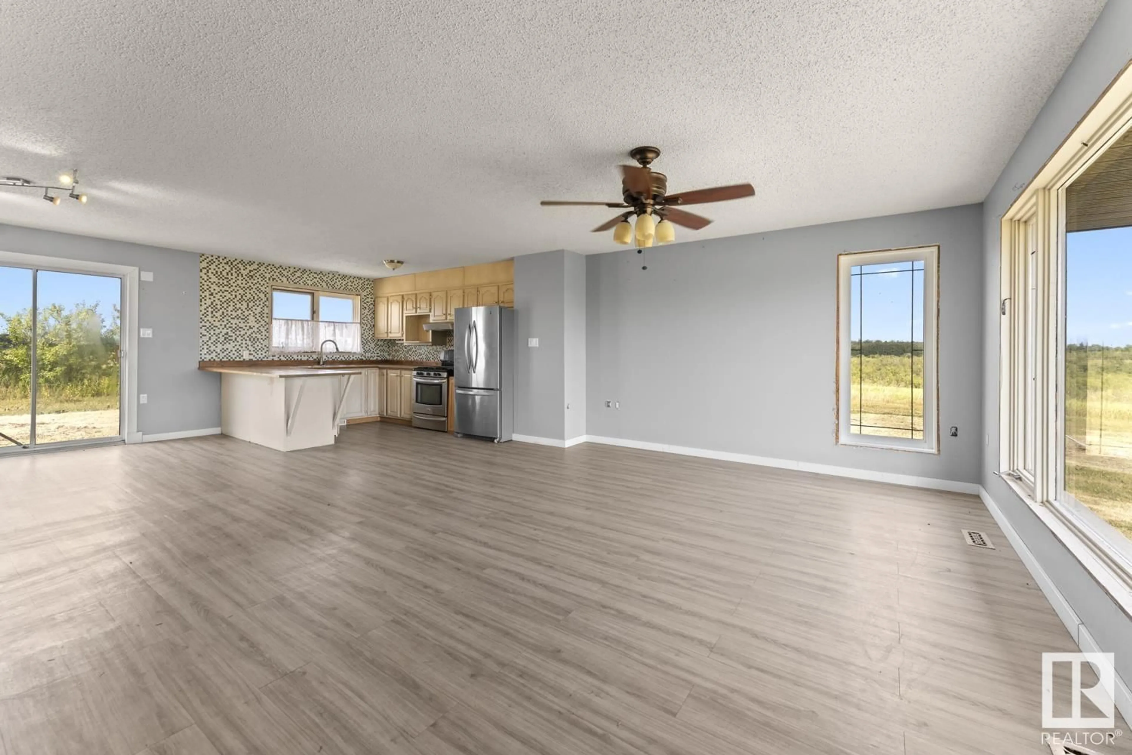 Open concept kitchen, wood/laminate floor for 42128 TWP RD 620, Rural Bonnyville M.D. Alberta T9M1P4