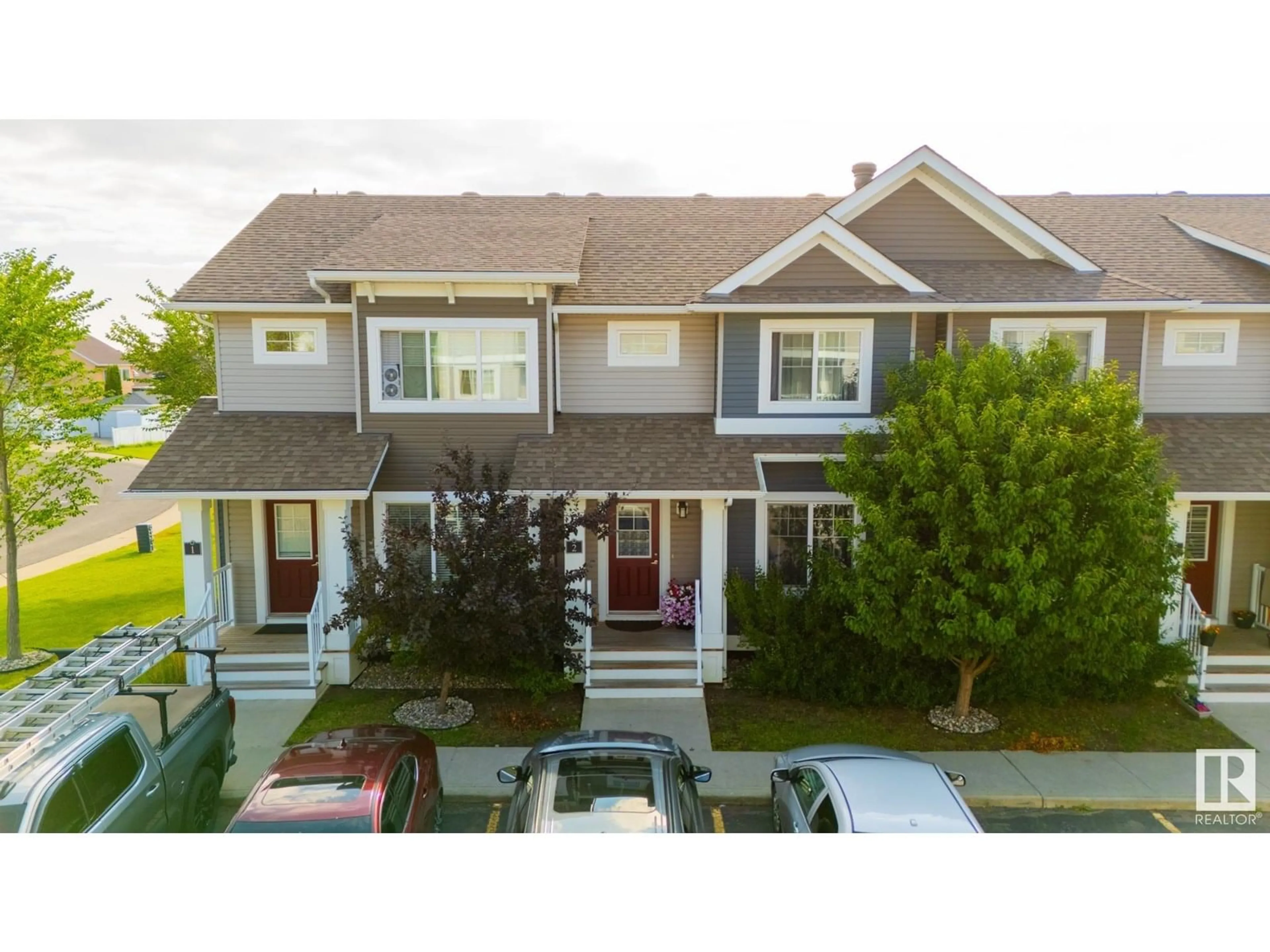 Home with vinyl exterior material, street for #2 - 5203 149 AV, Edmonton Alberta T5A3S1