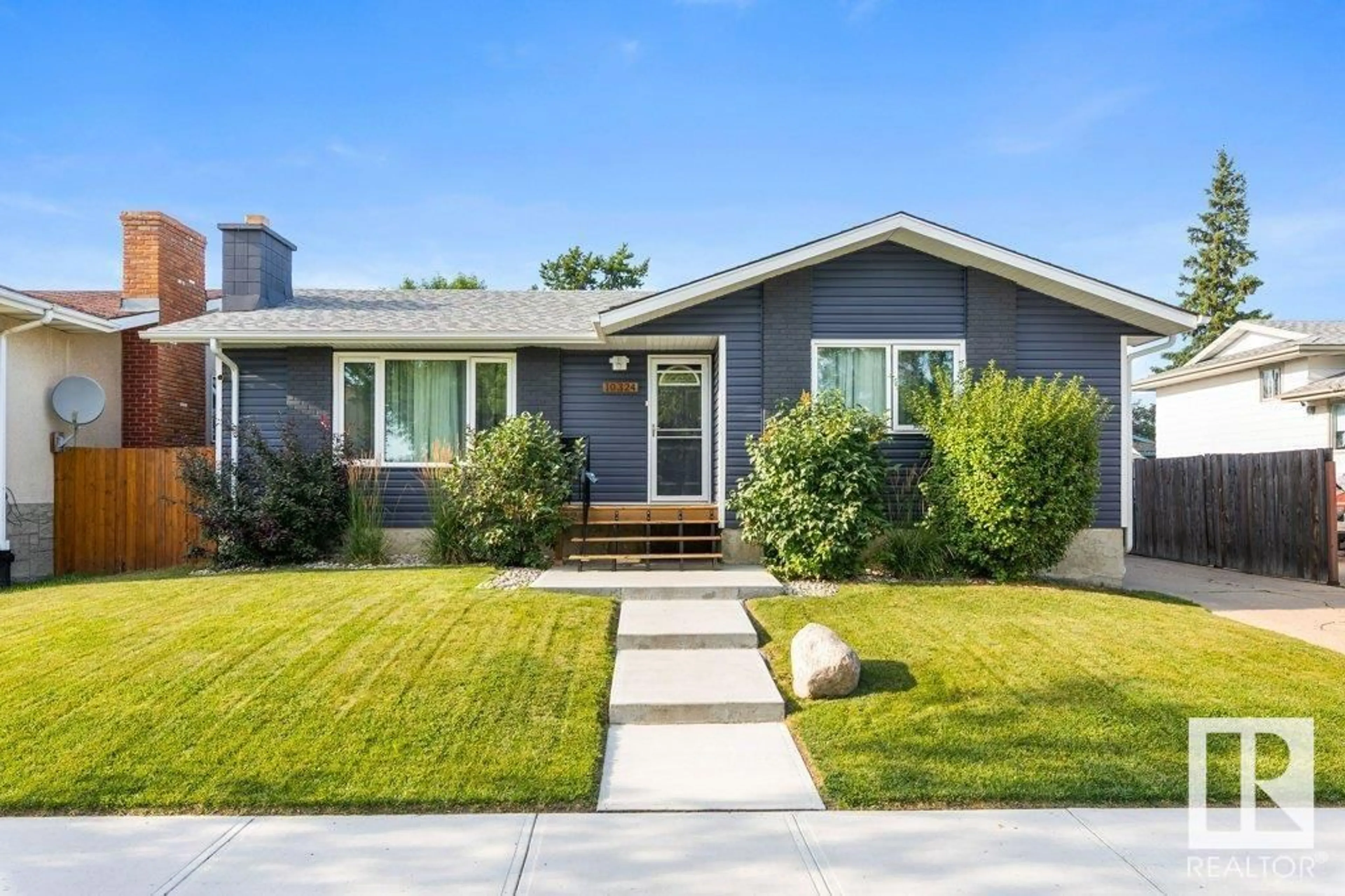 Home with vinyl exterior material, street for 10324 164 AV, Edmonton Alberta T5X2E2