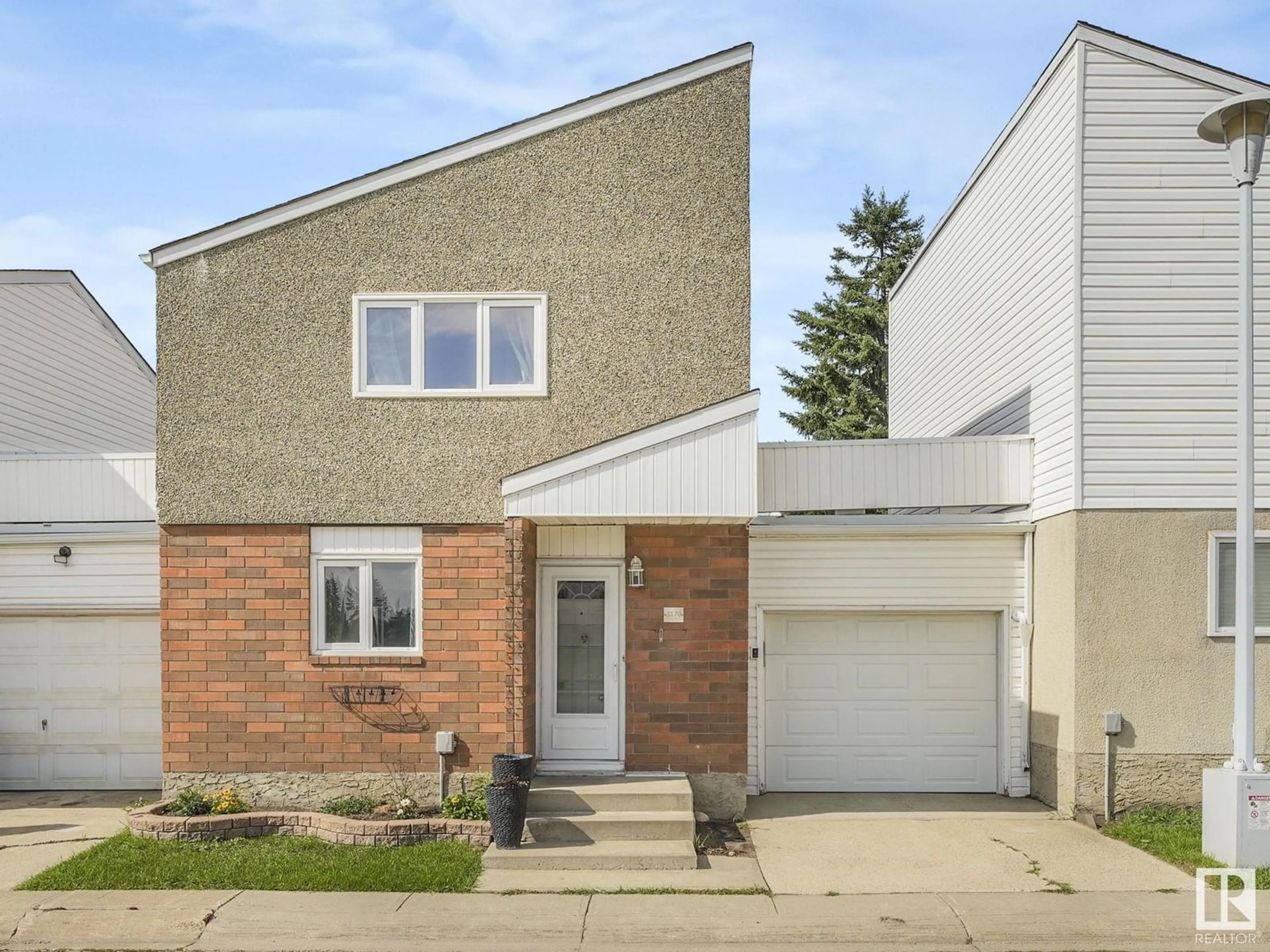 Home with brick exterior material, street for 1170 MILLBOURNE E NW, Edmonton Alberta T6K1W1