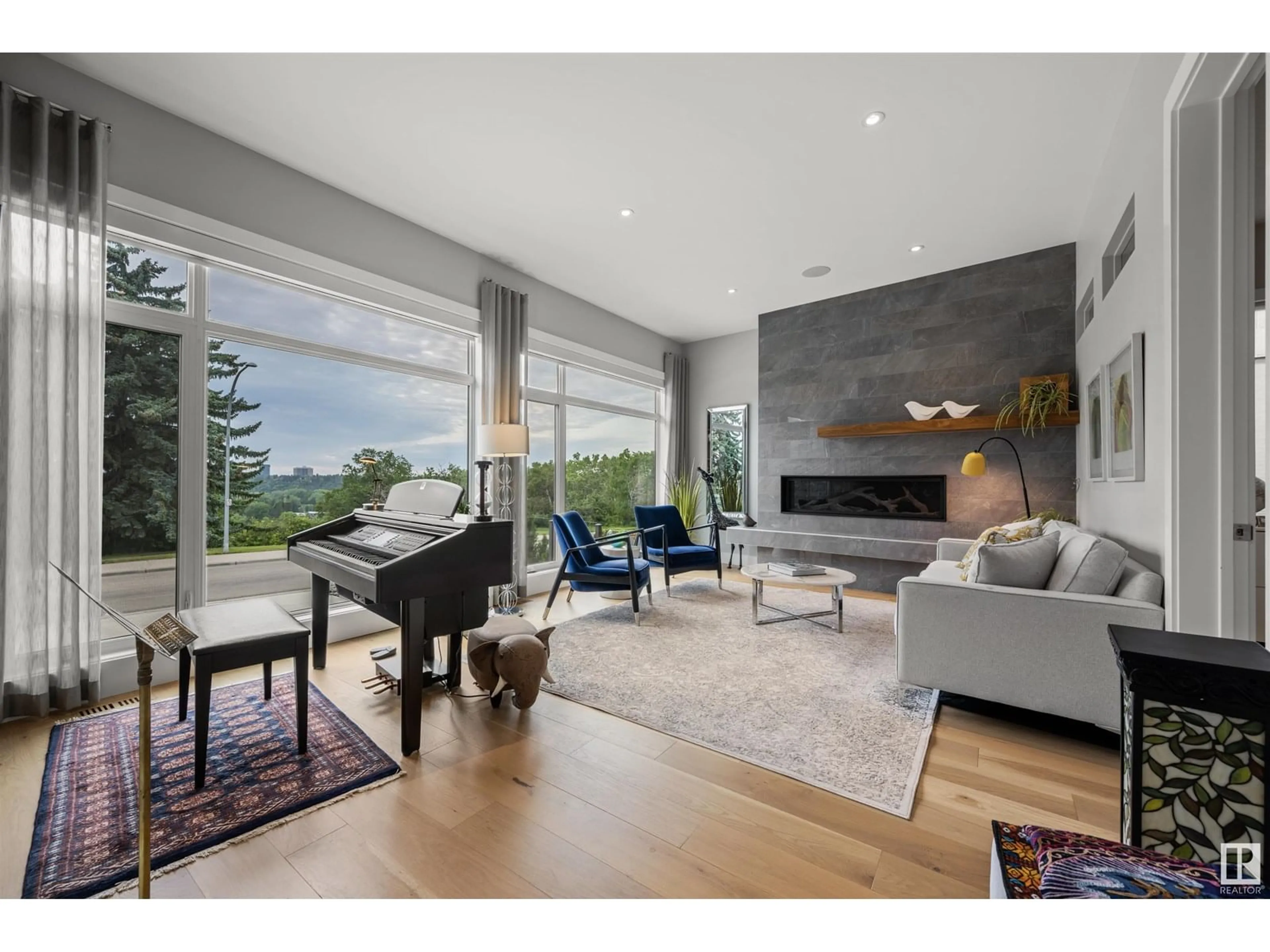 Living room with furniture, wood/laminate floor for 11835 SASKATCHEWAN DR, Edmonton Alberta T6G2B6