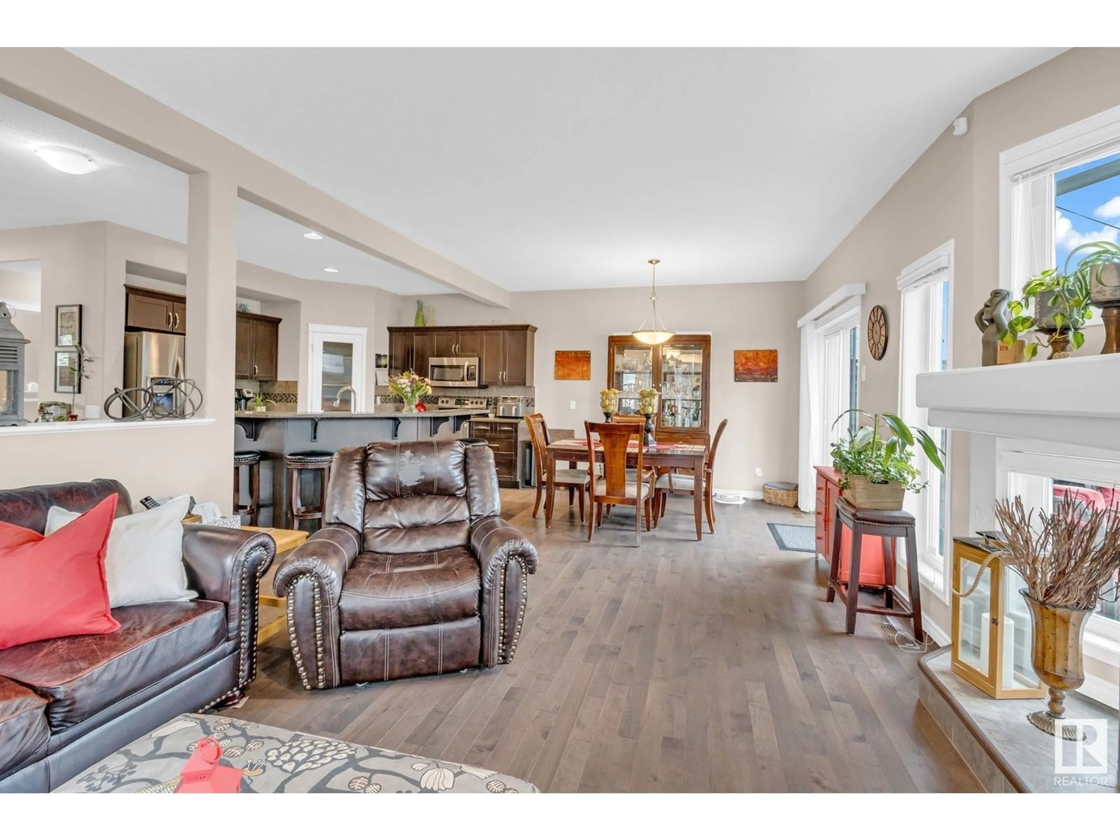 Living room with furniture, wood/laminate floor for 1426 CAREY WY, Edmonton Alberta T6W0Y8