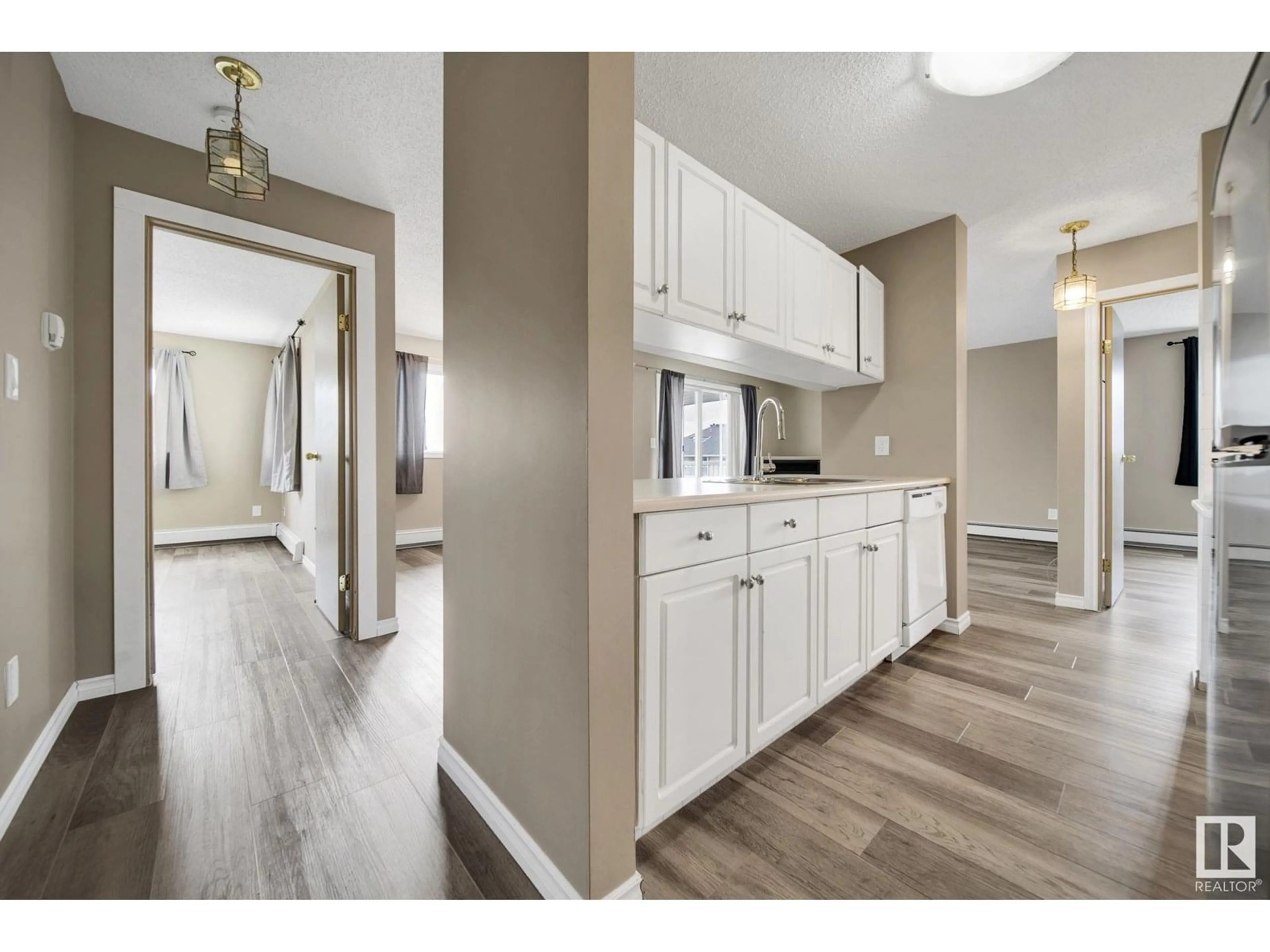 Open concept kitchen, wood/laminate floor for 401 - 4220 139 AVE NW, Edmonton Alberta T5Y2Y2