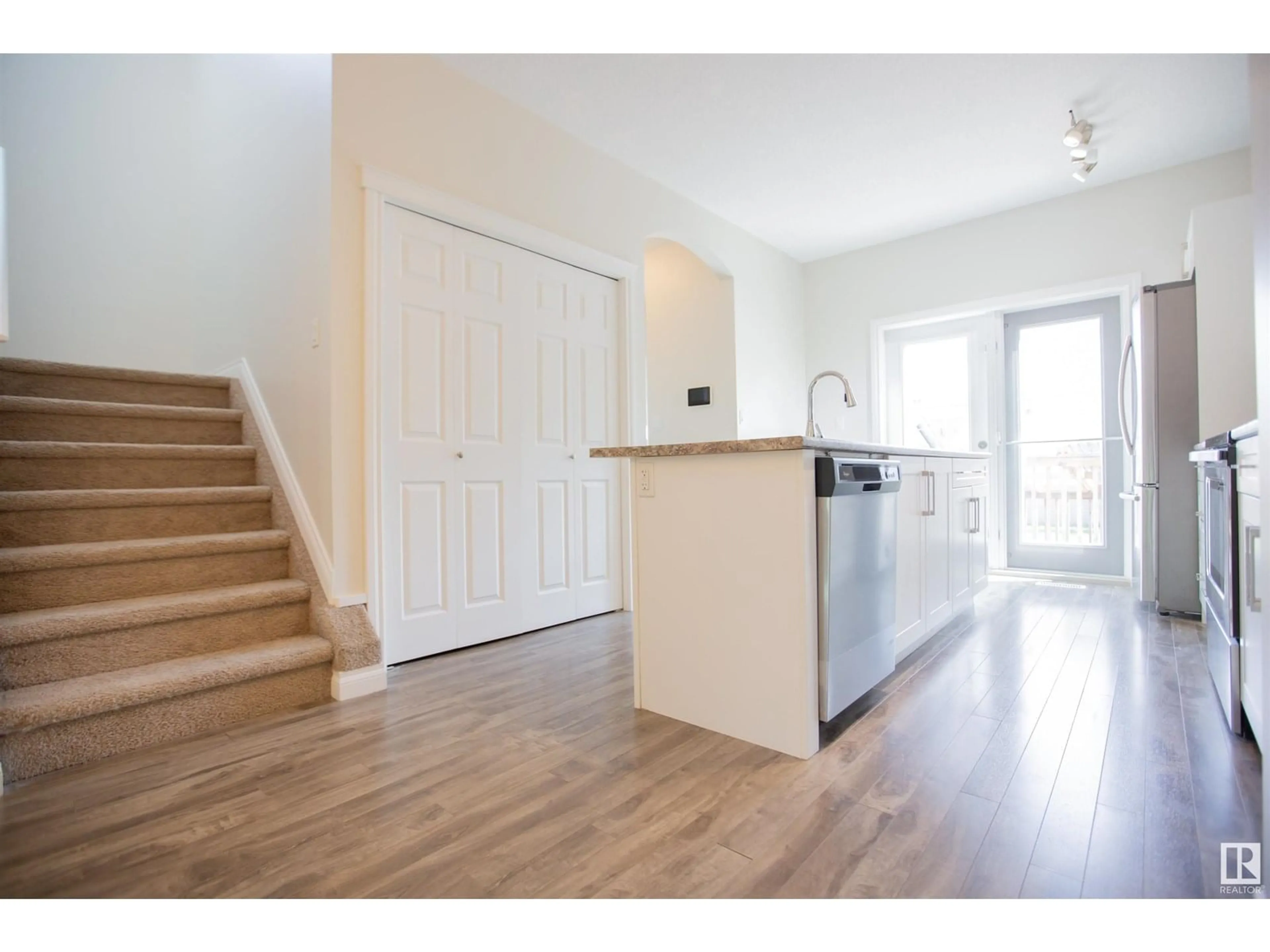 Open concept kitchen, wood/laminate floor for NW - 11215 125 ST, Edmonton Alberta T5M0M6