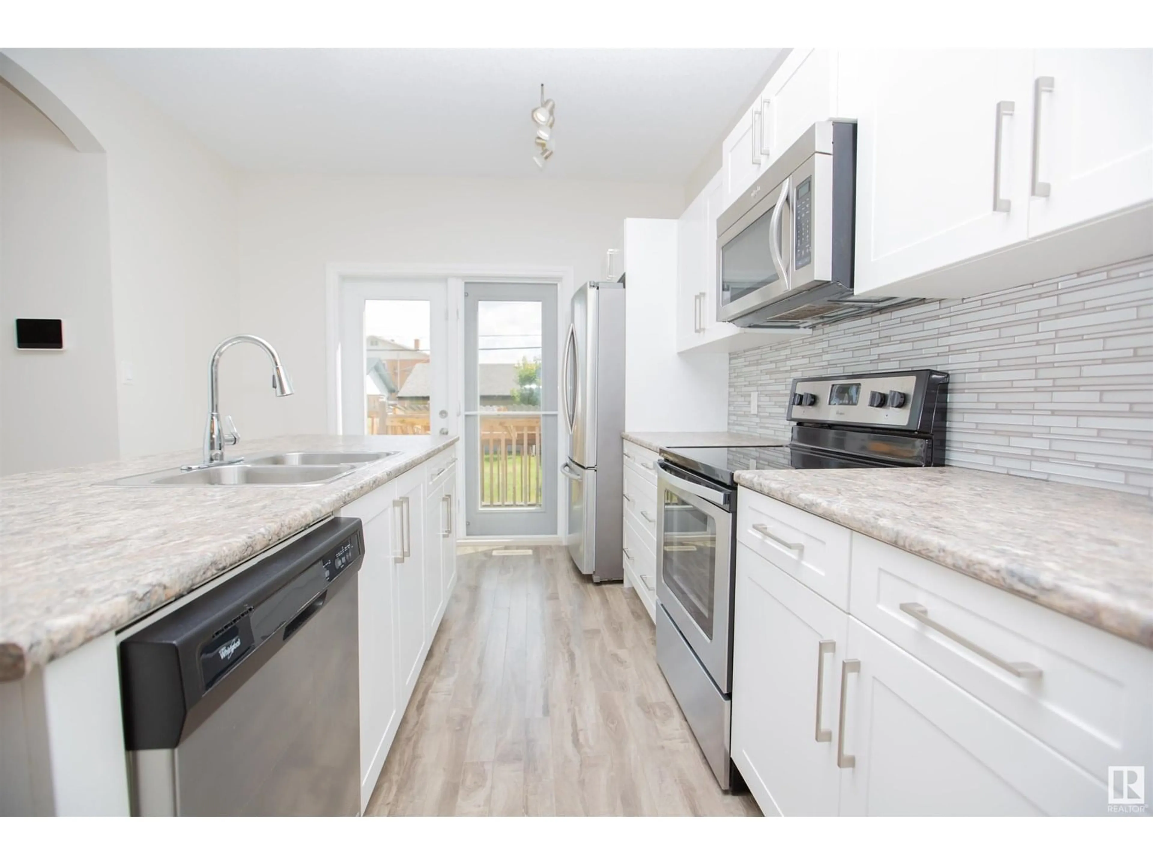Open concept kitchen, unknown for NW - 11215 125 ST, Edmonton Alberta T5M0M6
