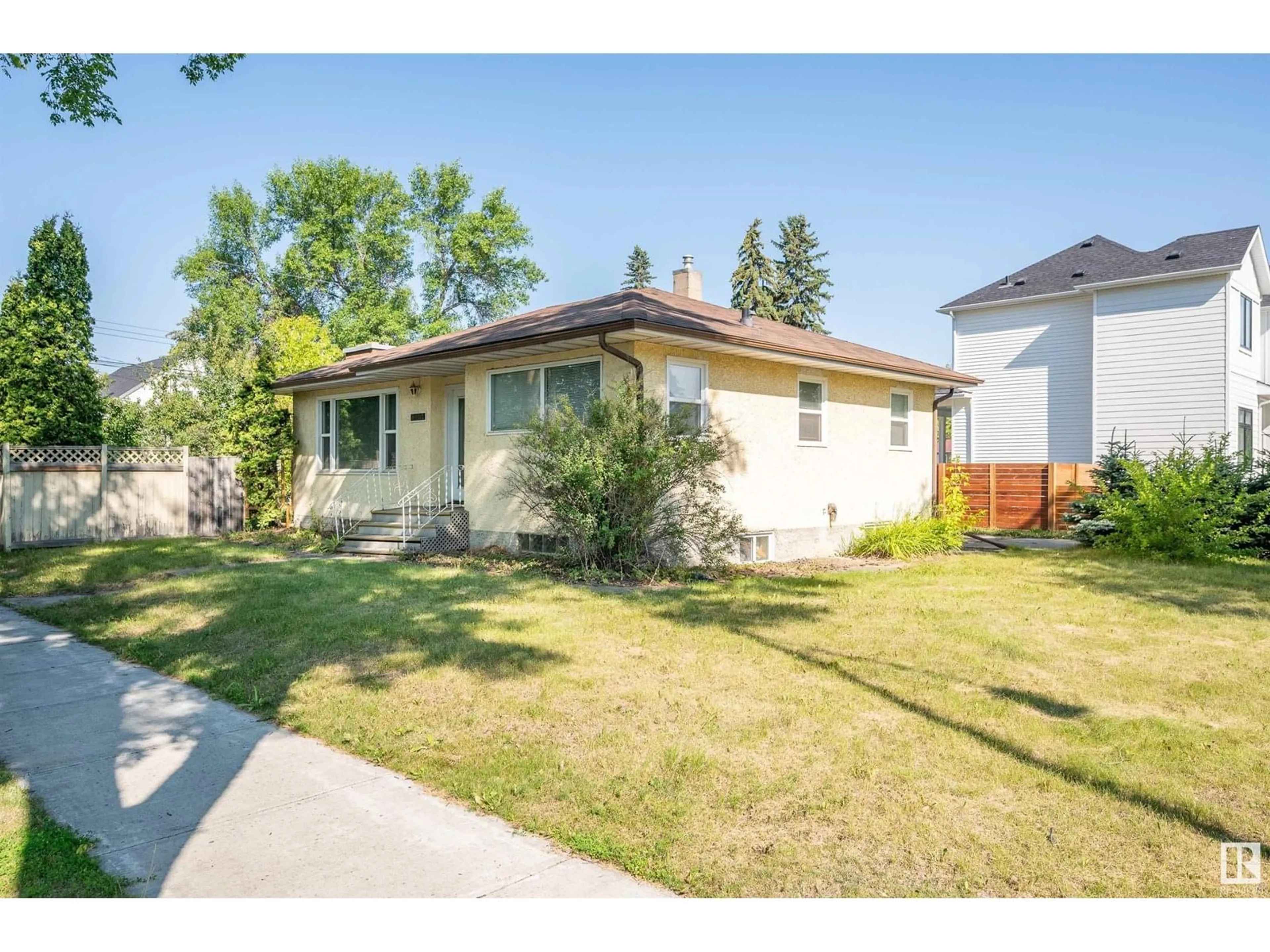 Home with vinyl exterior material, street for 13904 109A AV NW, Edmonton Alberta T5M2K3
