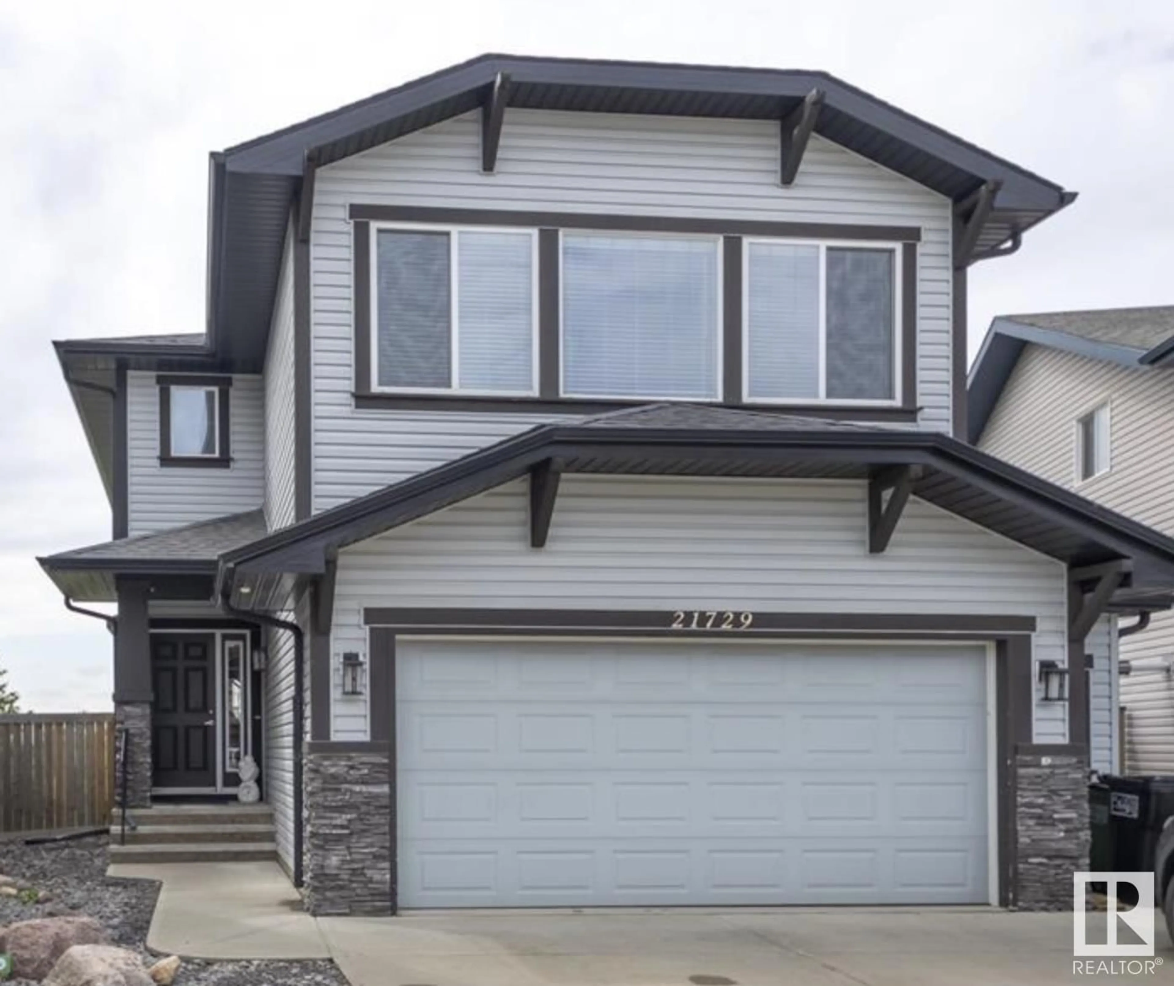Home with vinyl exterior material, street for 21729 94A AV, Edmonton Alberta T5T1M9