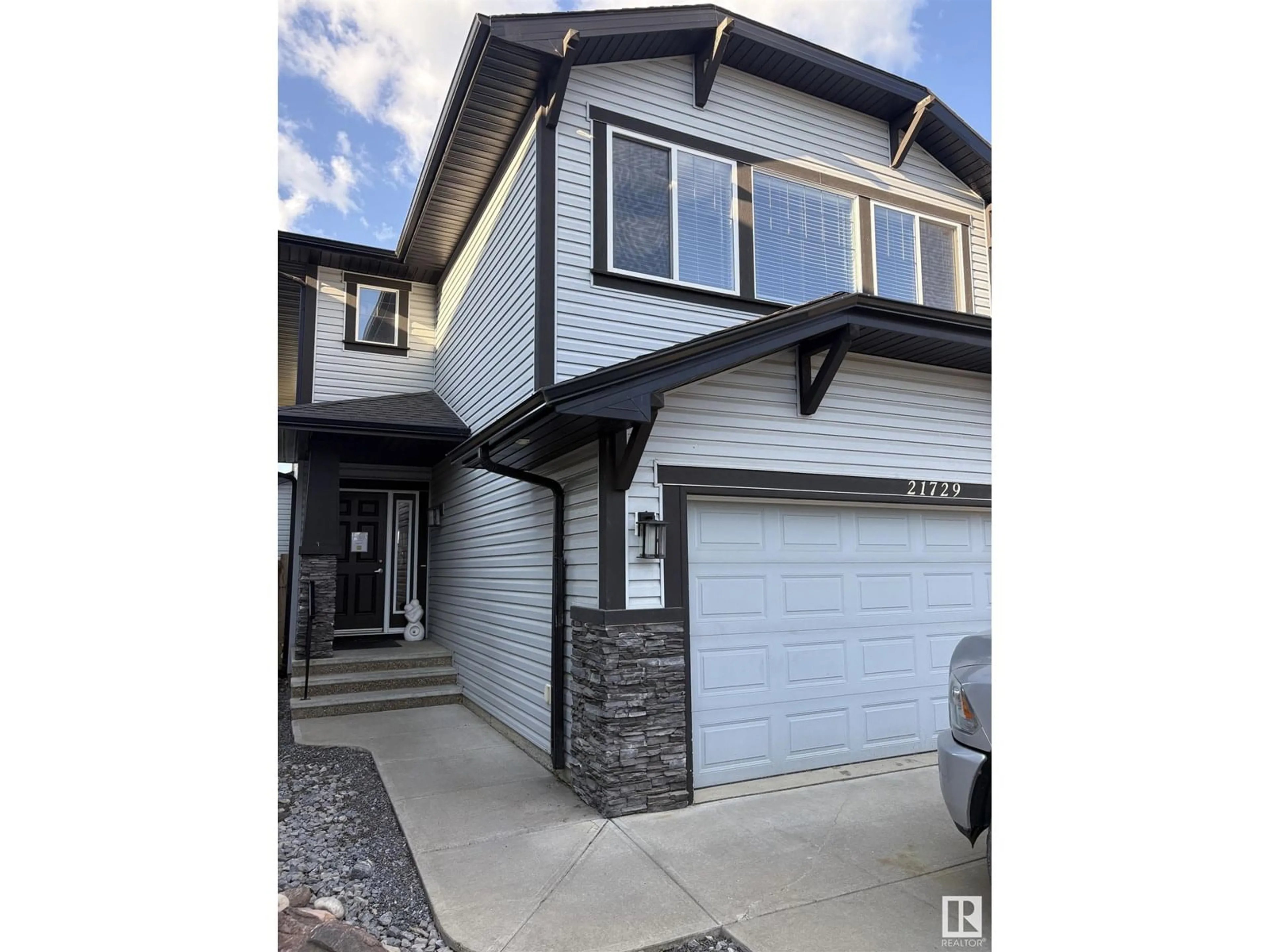 Home with vinyl exterior material, street for 21729 94A AV, Edmonton Alberta T5T1M9
