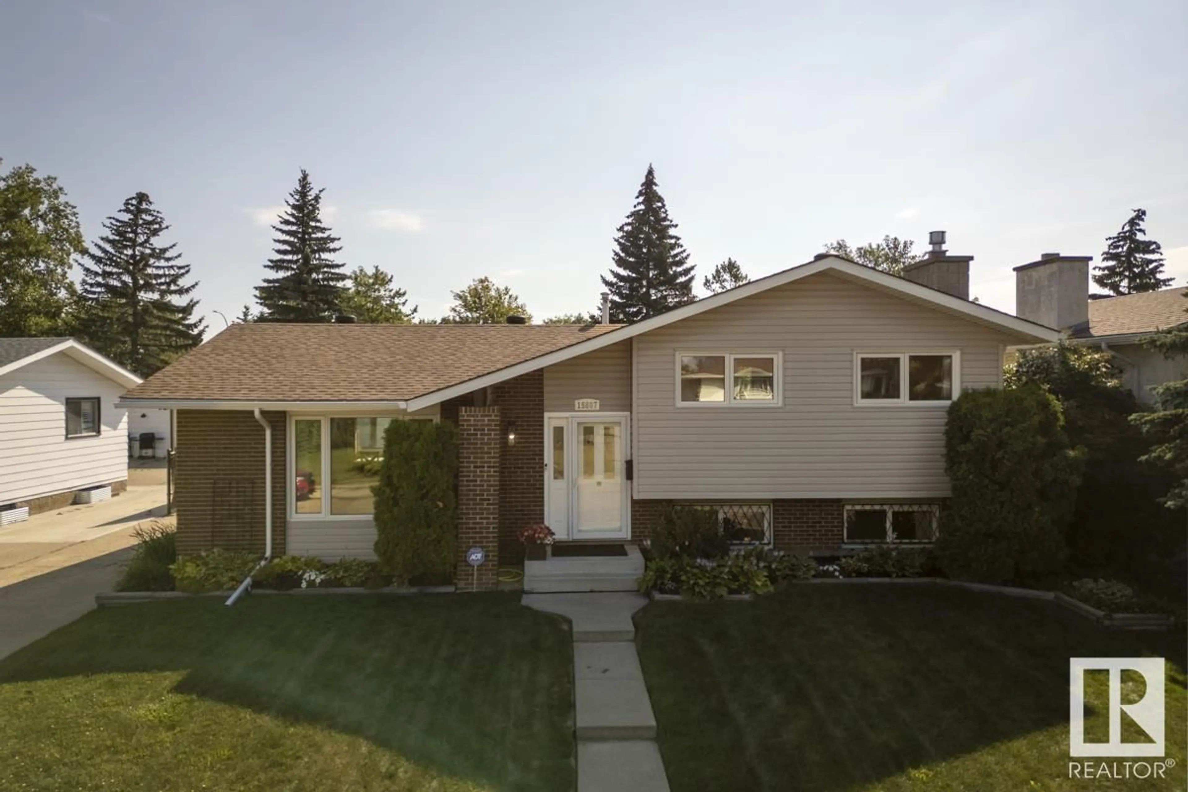 Home with vinyl exterior material, street for NW - 15807 114 ST, Edmonton Alberta T5X2V2