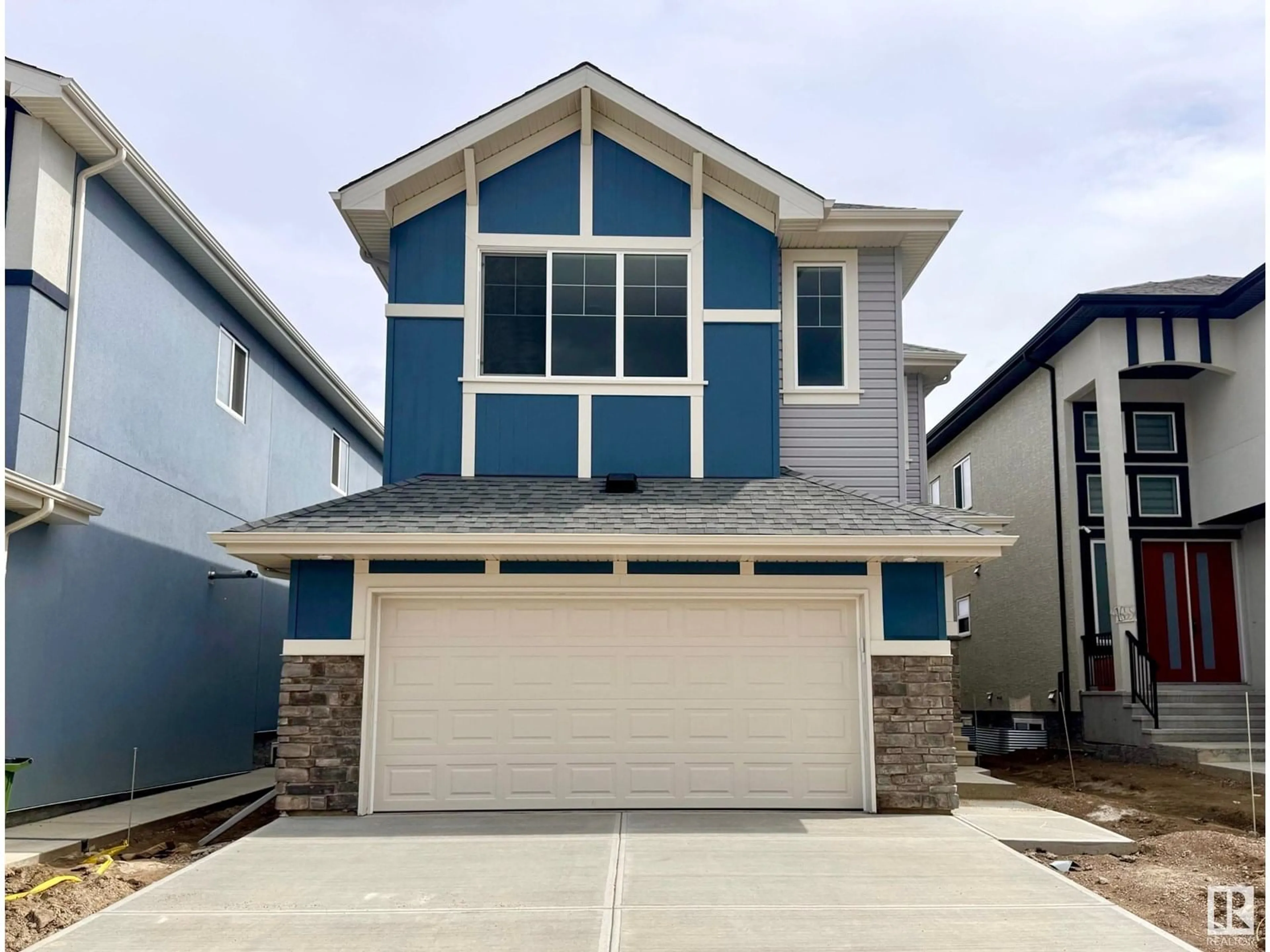 Home with vinyl exterior material, street for 1659 12 ST, Edmonton Alberta T6T2V1