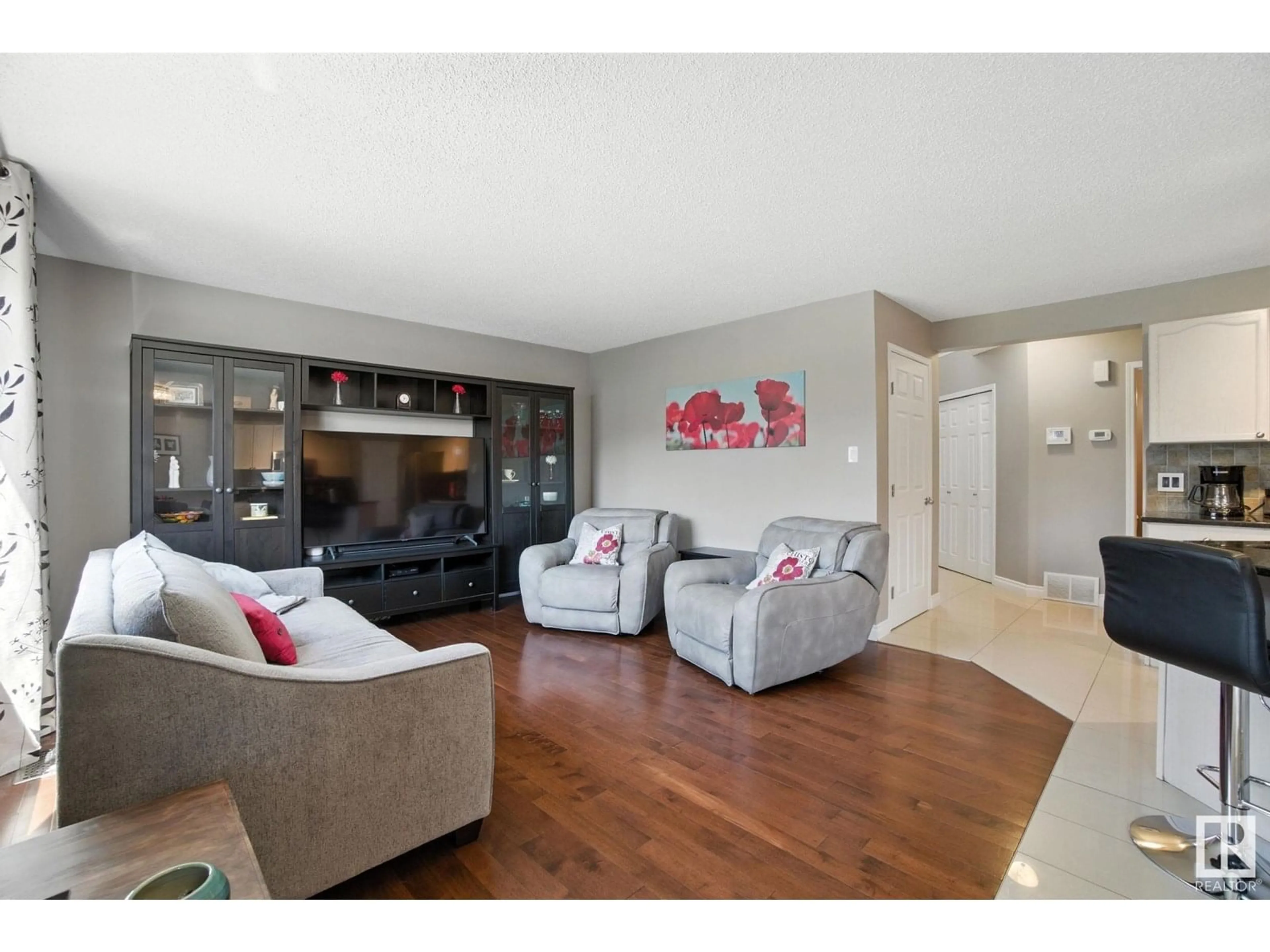 Living room with furniture, wood/laminate floor for 9 HEATHERGLEN CL, Spruce Grove Alberta T7X4H9