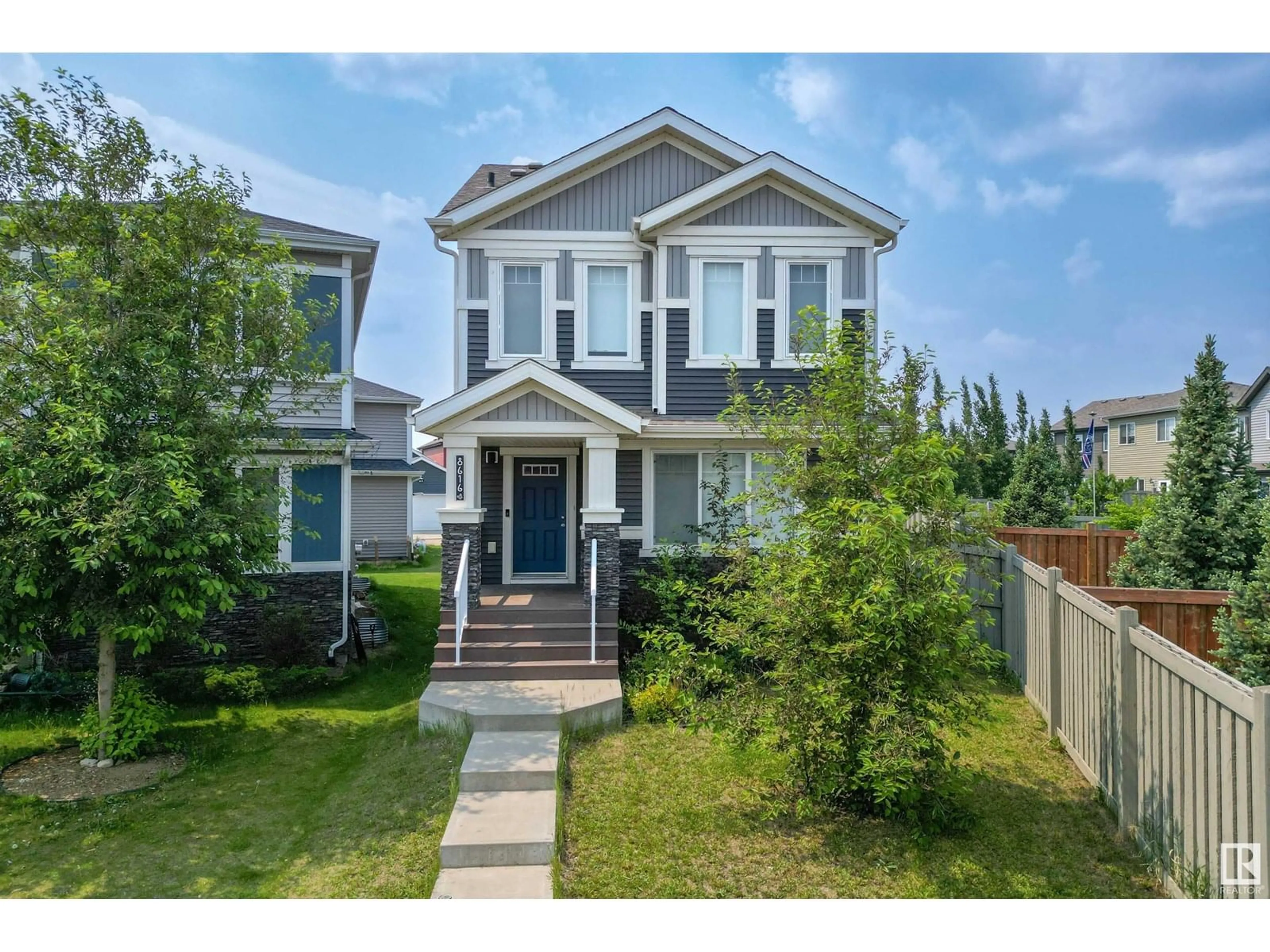 Home with vinyl exterior material, street for NW - 8616 221 ST, Edmonton Alberta T5T7H7