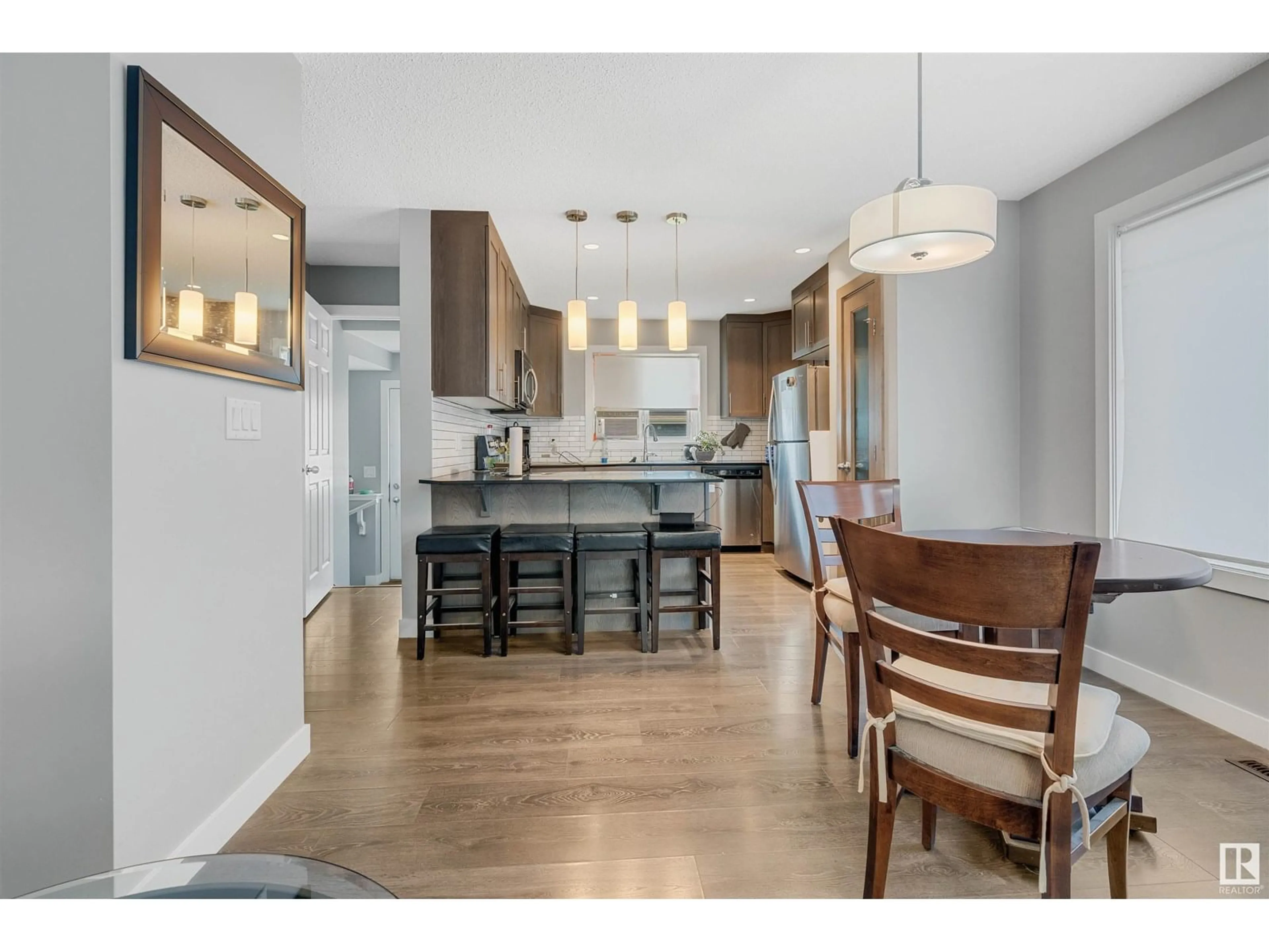 Open concept kitchen, wood/laminate floor for NW - 8616 221 ST, Edmonton Alberta T5T7H7