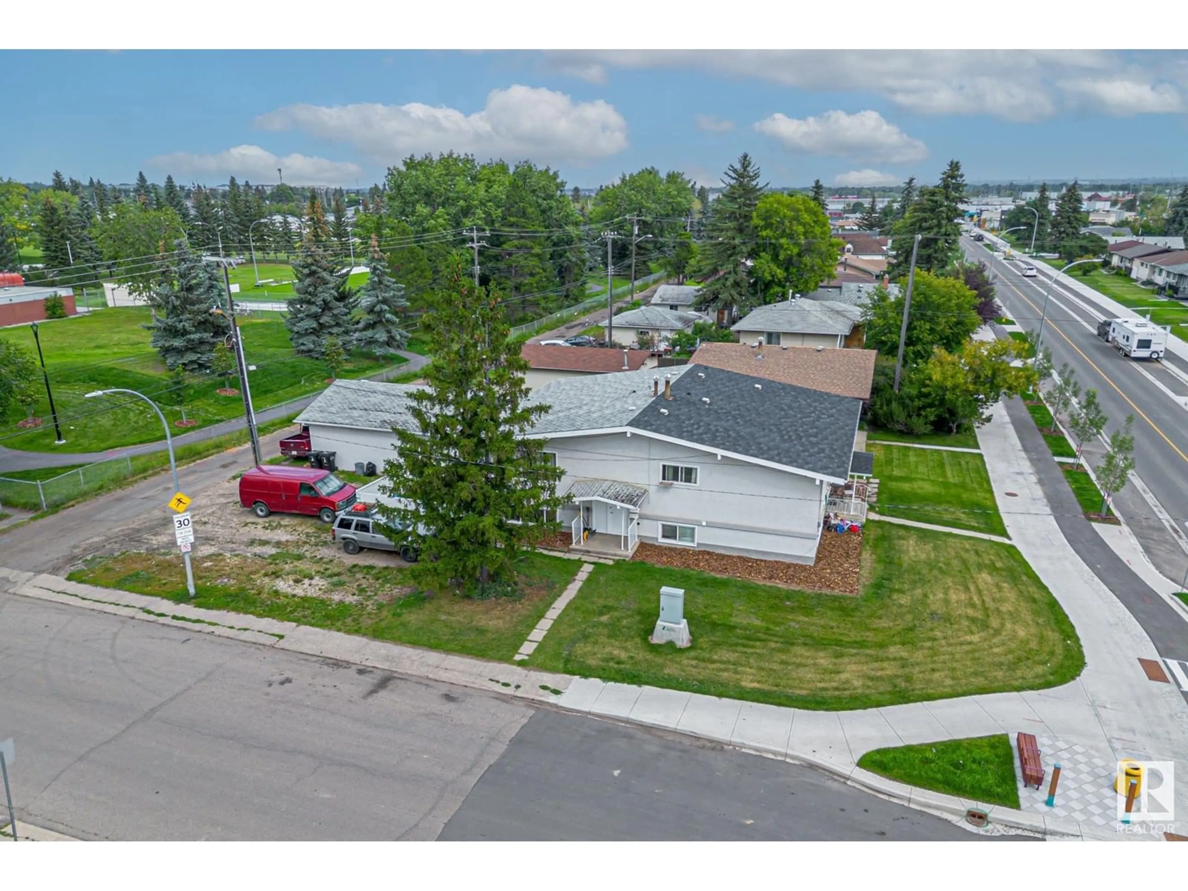 A pic from outside/outdoor area/front of a property/back of a property/a pic from drone, street for 6120 132 AV, Edmonton Alberta T5A0J3