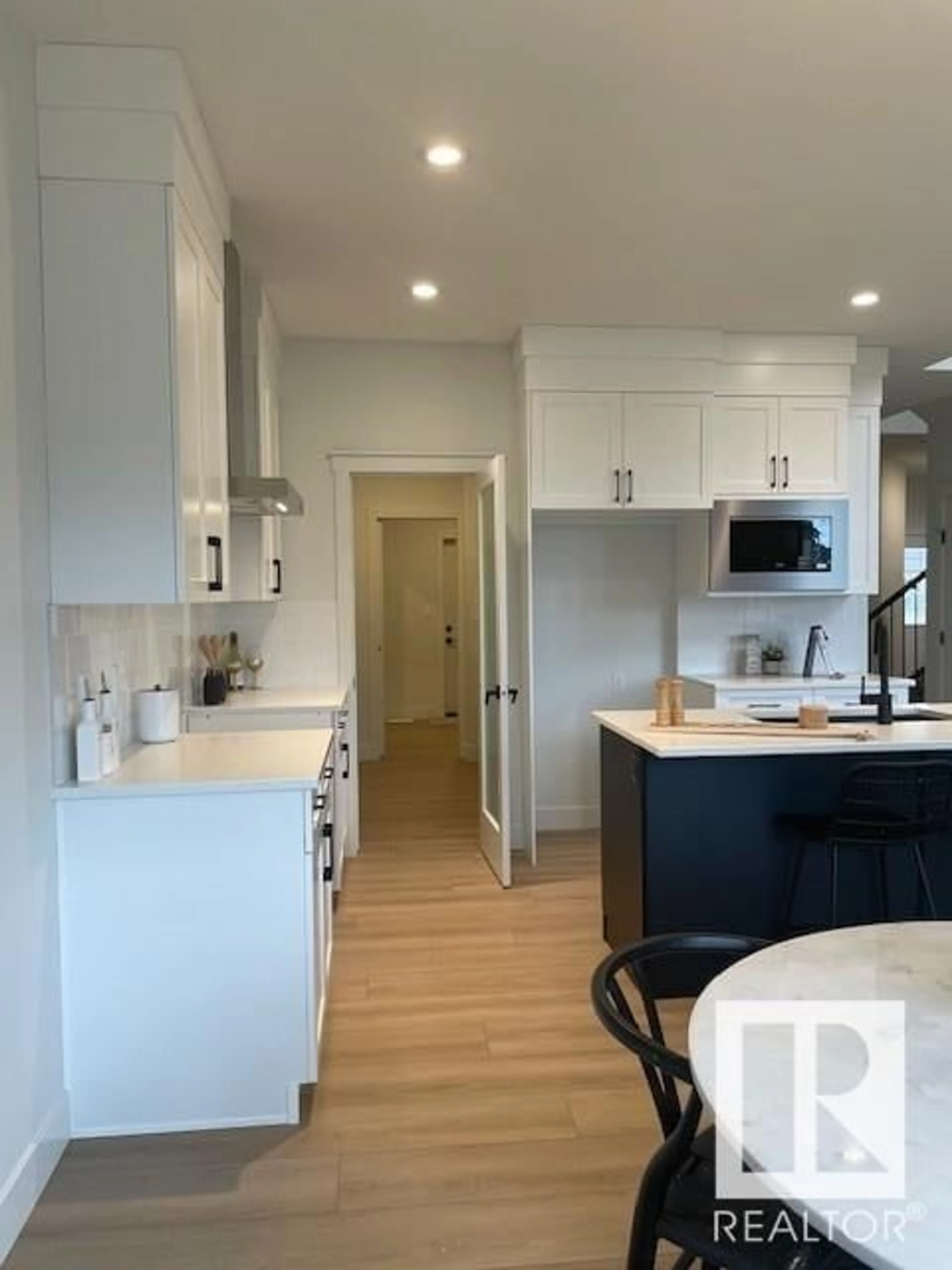 Open concept kitchen, wood/laminate floor for NW - 13051 212 ST, Edmonton Alberta T5S0T8