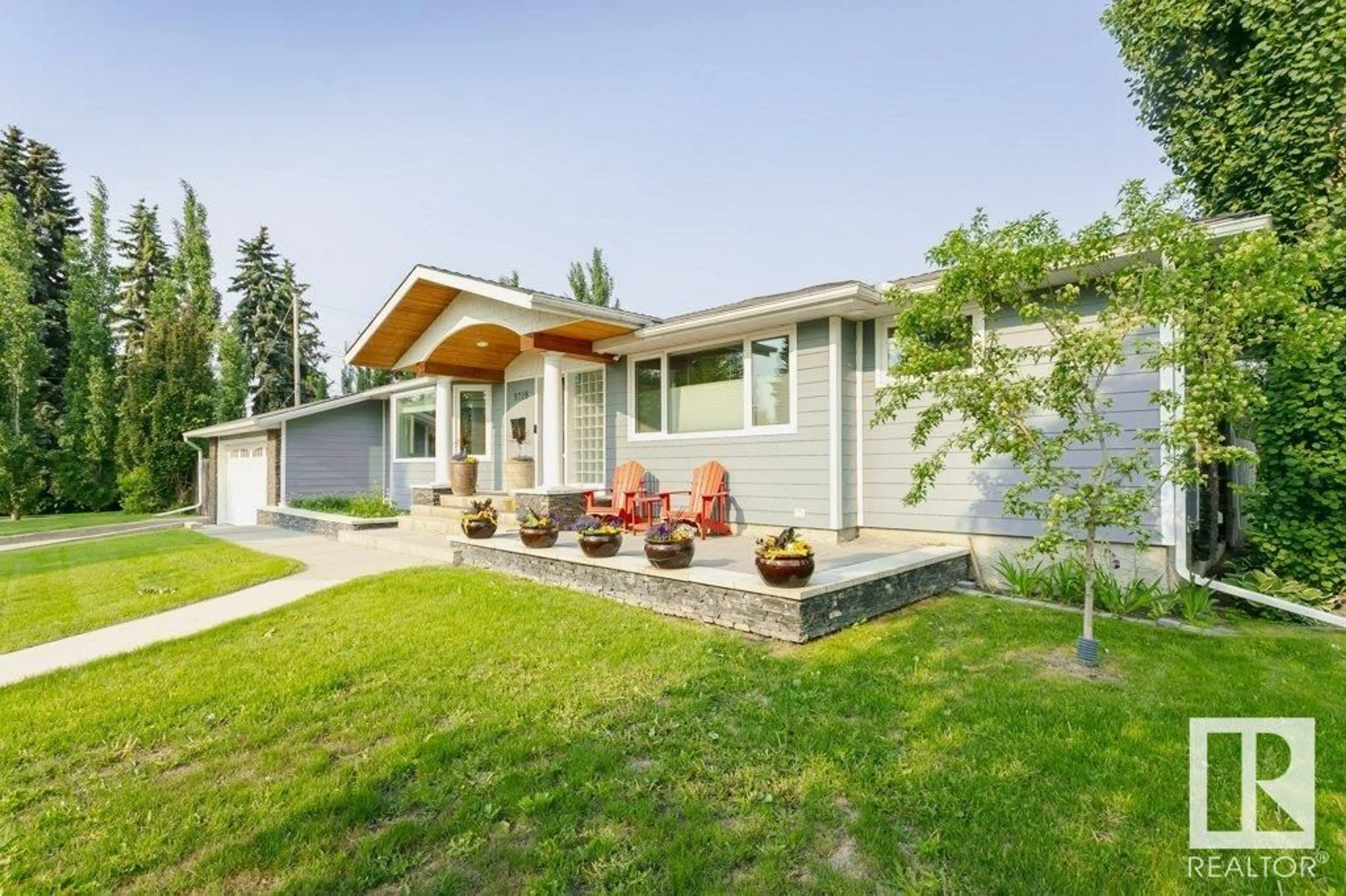 Home with vinyl exterior material, street for 9728 141 ST, Edmonton Alberta T5N2R2