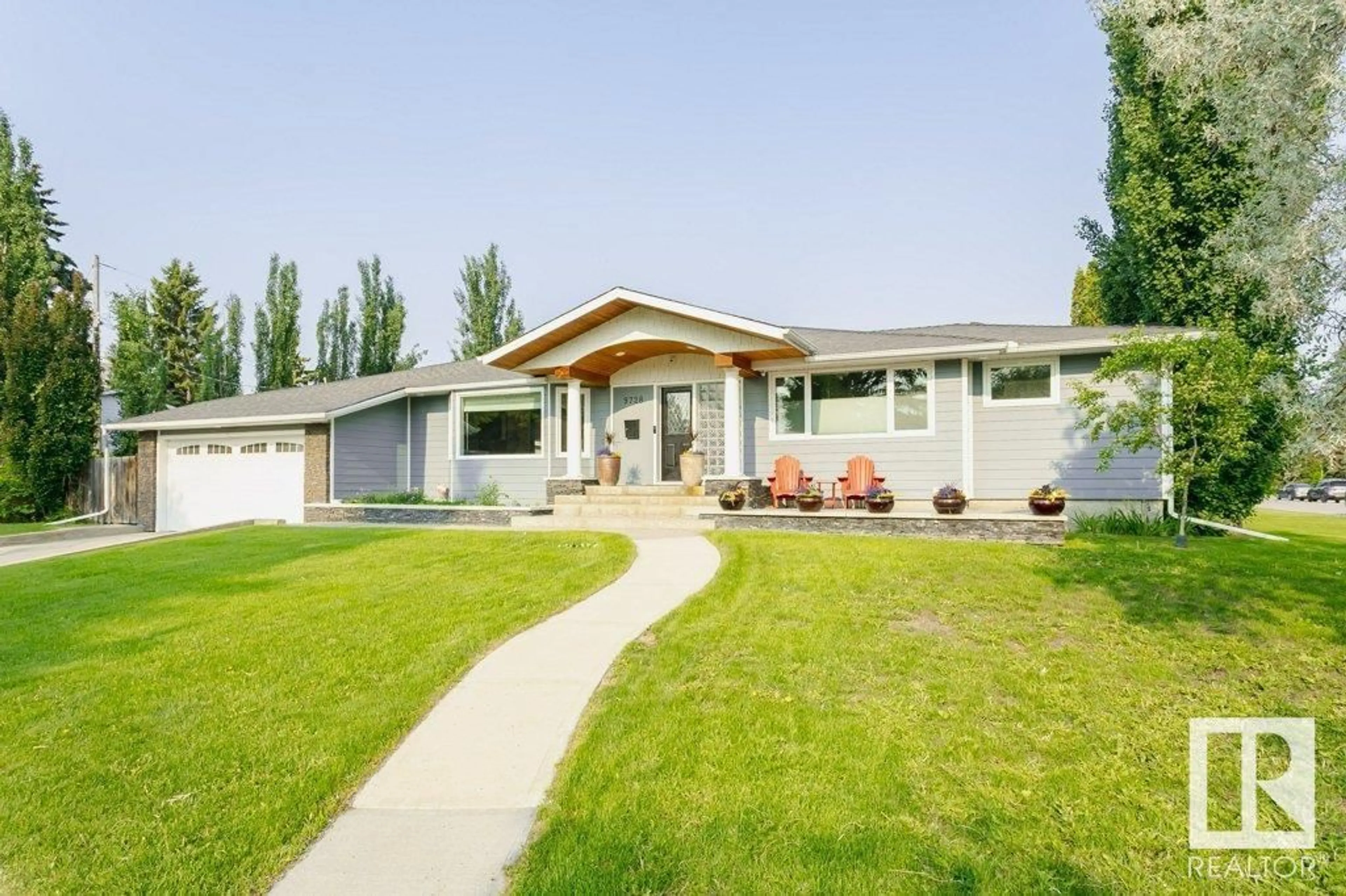 Home with vinyl exterior material, street for 9728 141 ST, Edmonton Alberta T5N2R2