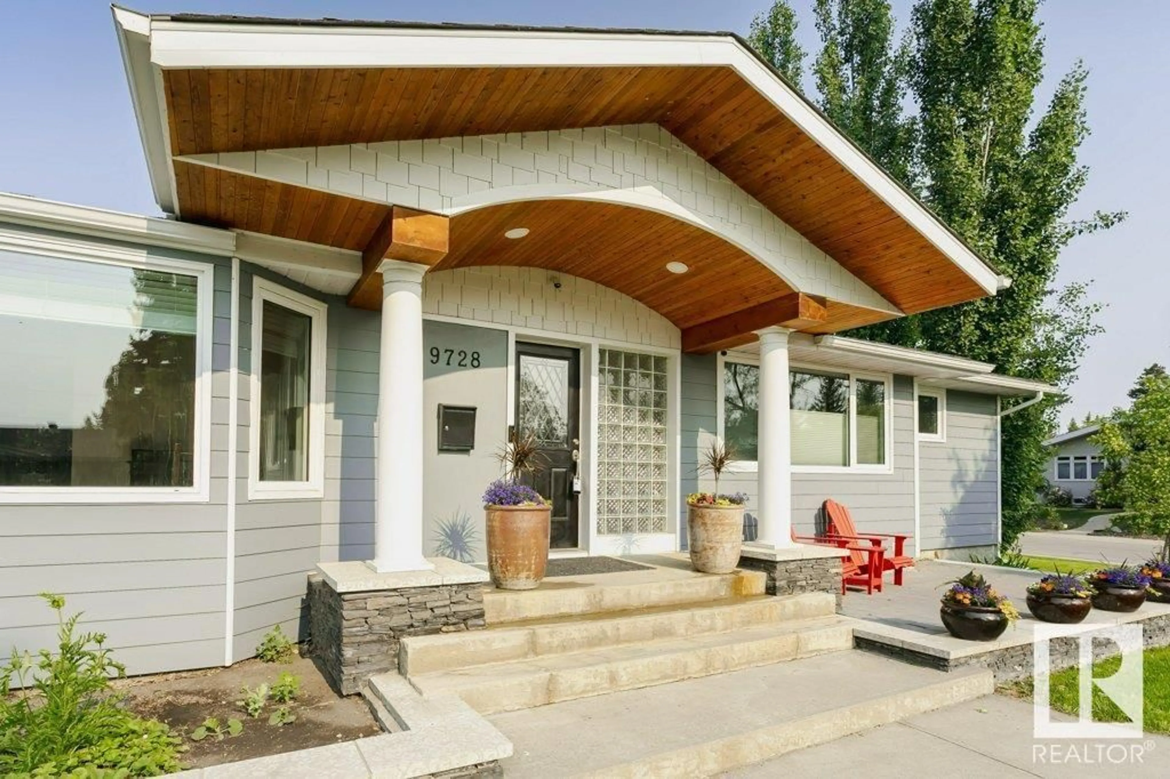 Home with vinyl exterior material, street for 9728 141 ST, Edmonton Alberta T5N2R2