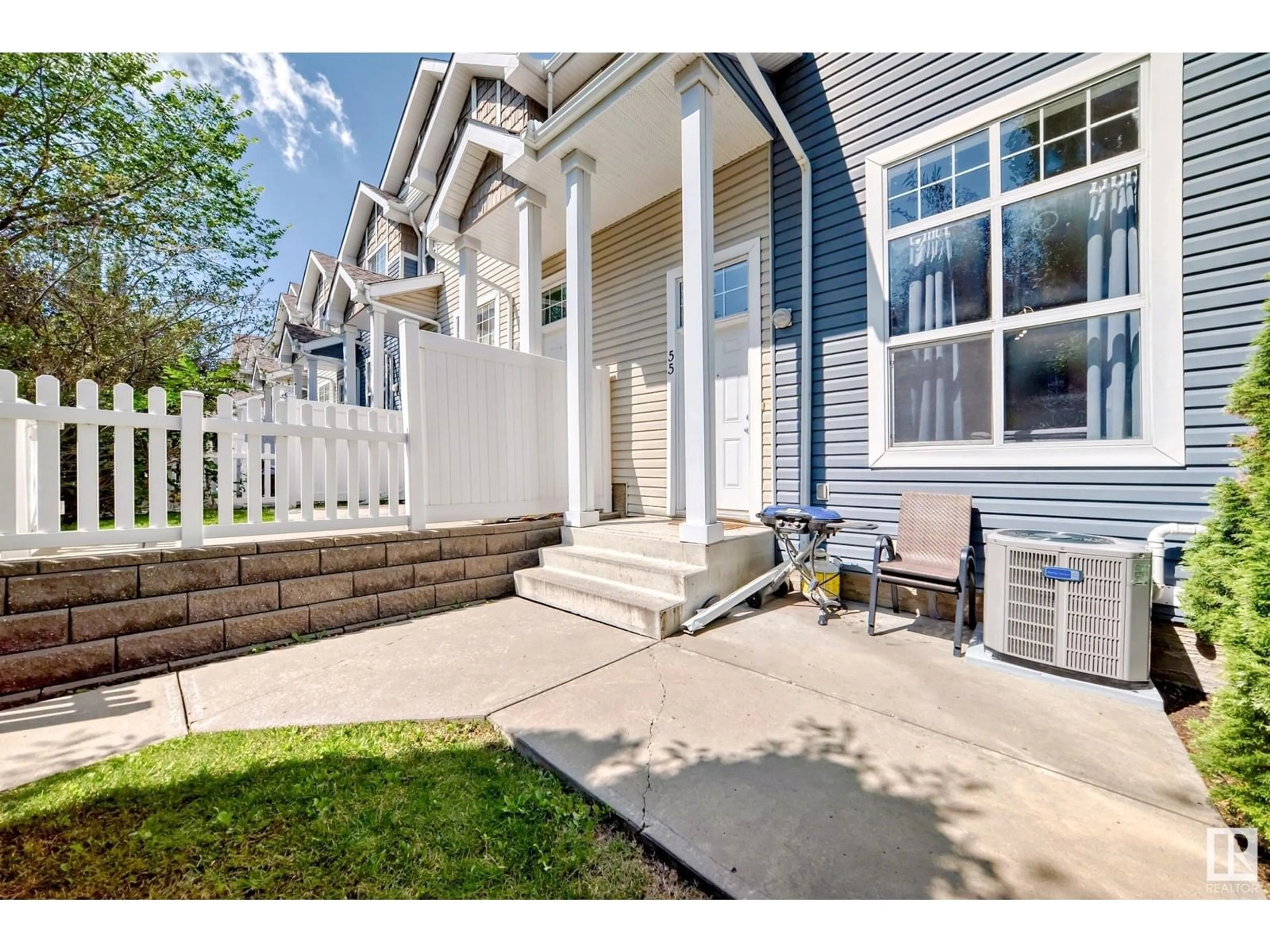 Home with vinyl exterior material, street for 55 - 5604 199 ST NW, Edmonton Alberta T6M2Z9