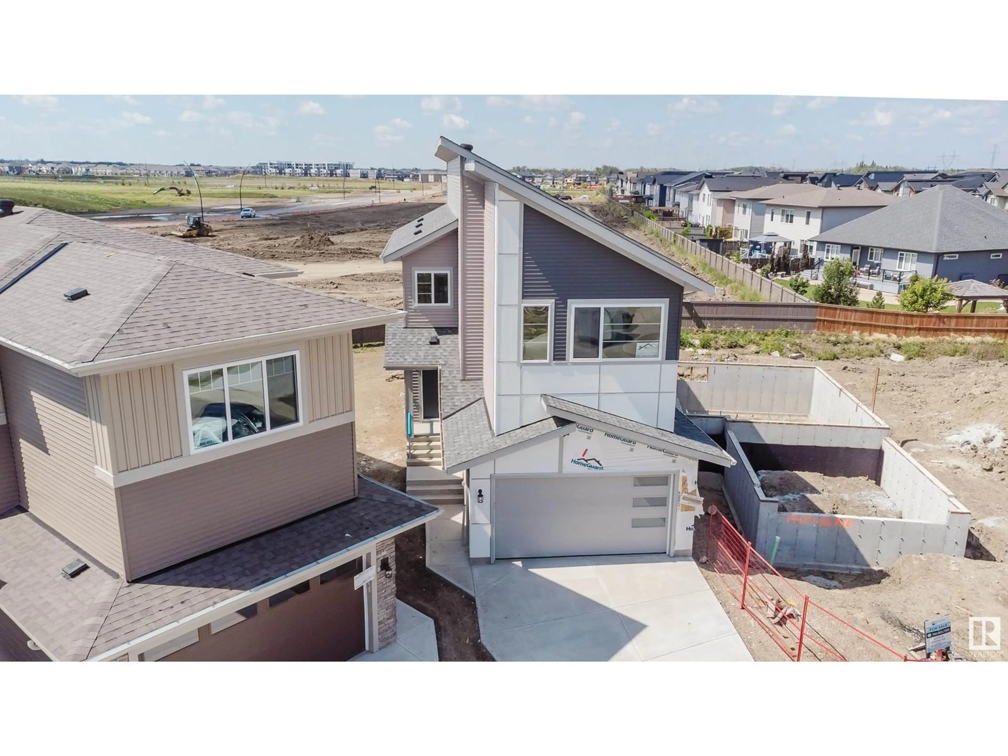 A pic from outside/outdoor area/front of a property/back of a property/a pic from drone, unknown for NW - 19427 26 AV, Edmonton Alberta T6M1P5