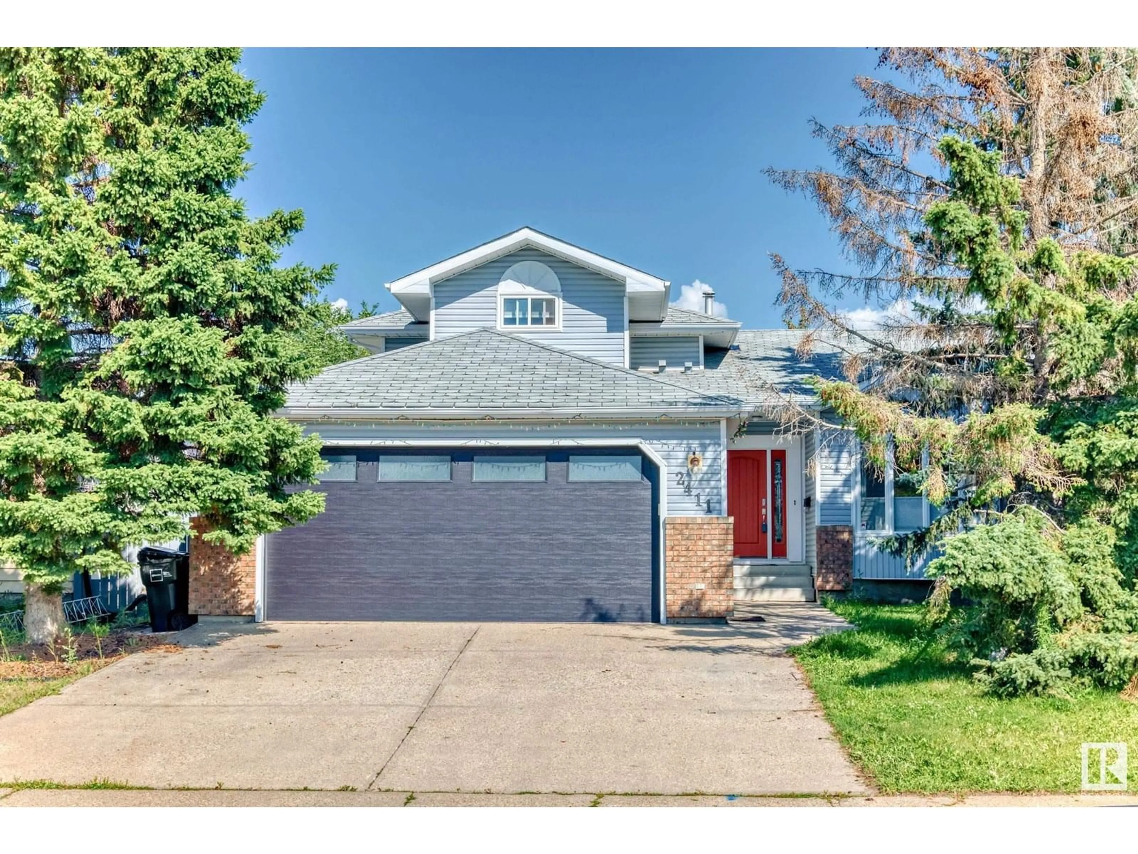 Home with vinyl exterior material, street for NW - 2411 78 ST, Edmonton Alberta T6K3W3