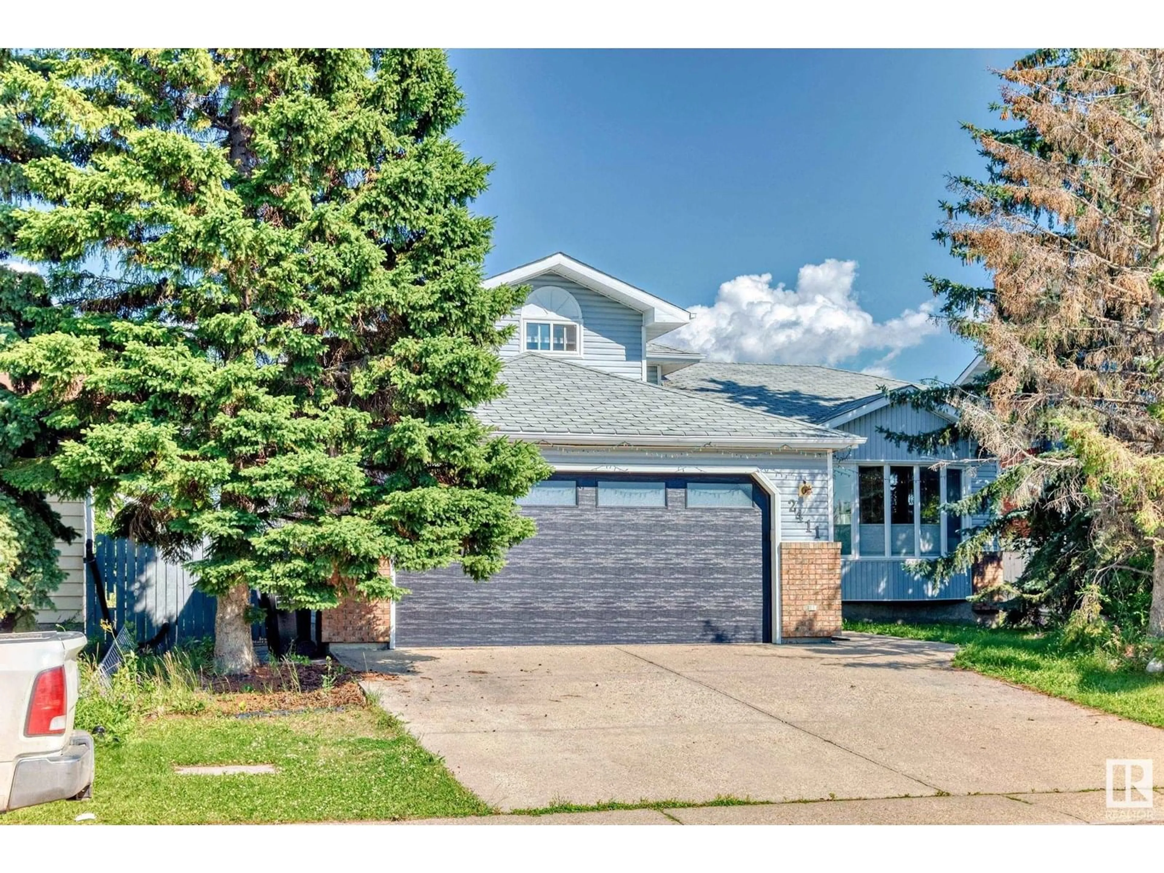 Home with vinyl exterior material, street for NW - 2411 78 ST, Edmonton Alberta T6K3W3