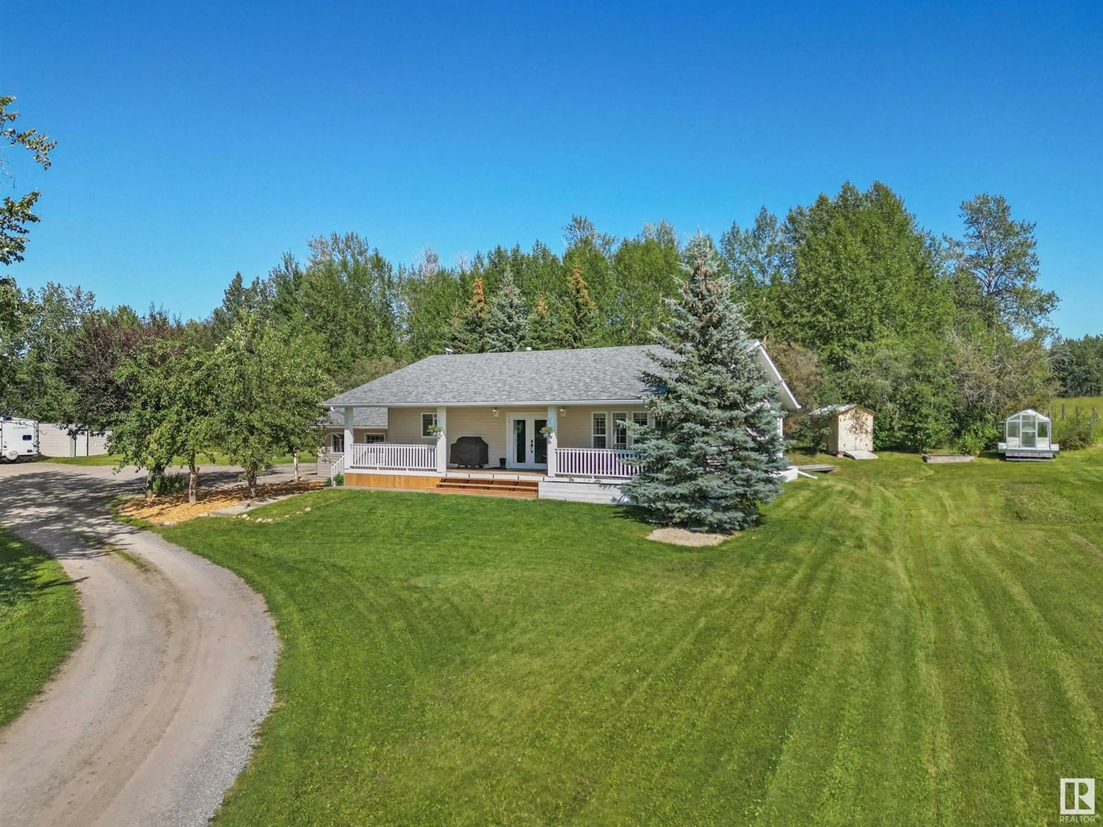 A pic from outside/outdoor area/front of a property/back of a property/a pic from drone, mountain view for SW - 111 6 ST, Rural Wetaskiwin County Alberta T0C0A0