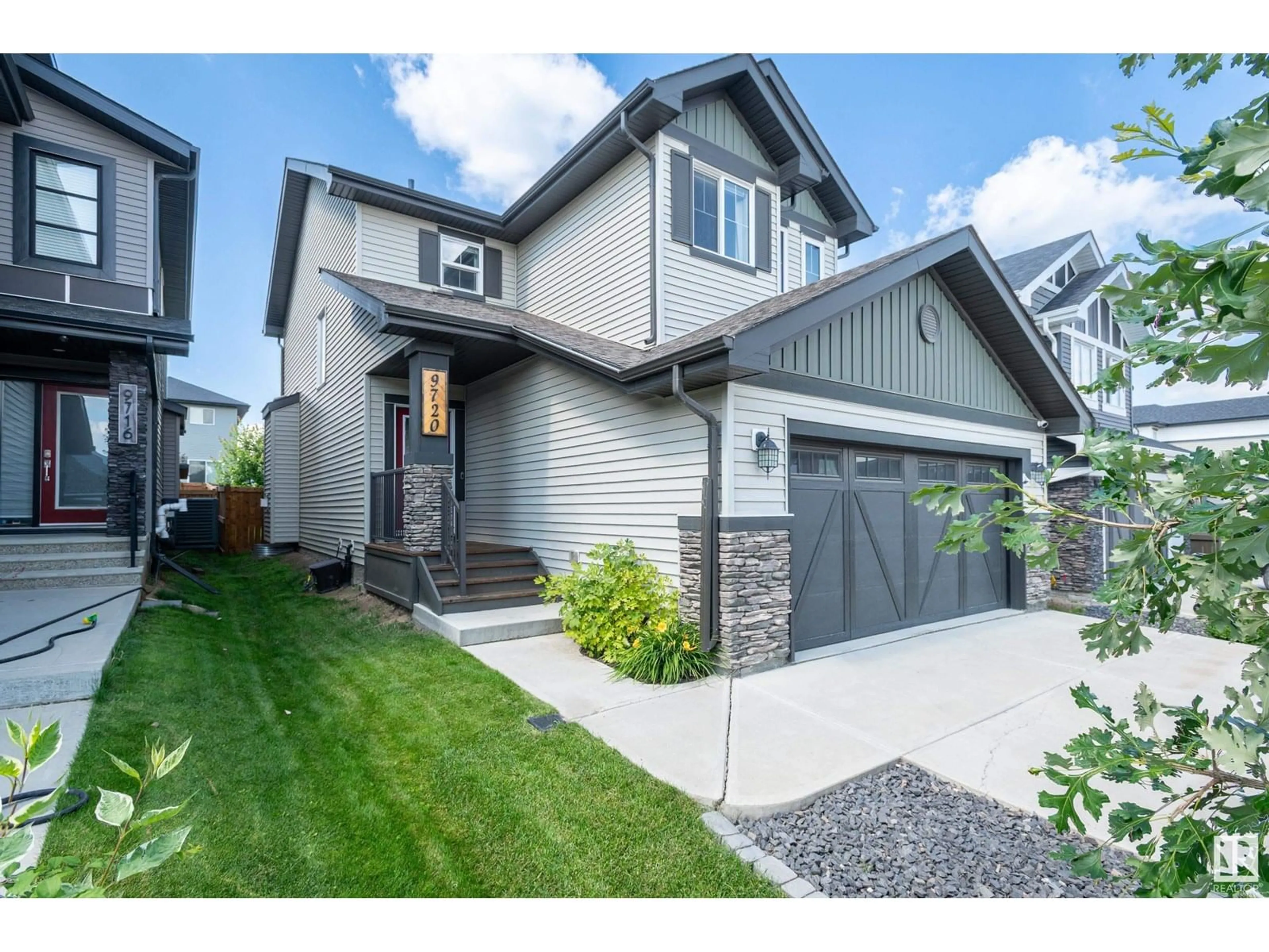 Home with vinyl exterior material, street for 9720 223 ST, Edmonton Alberta T5T7B7