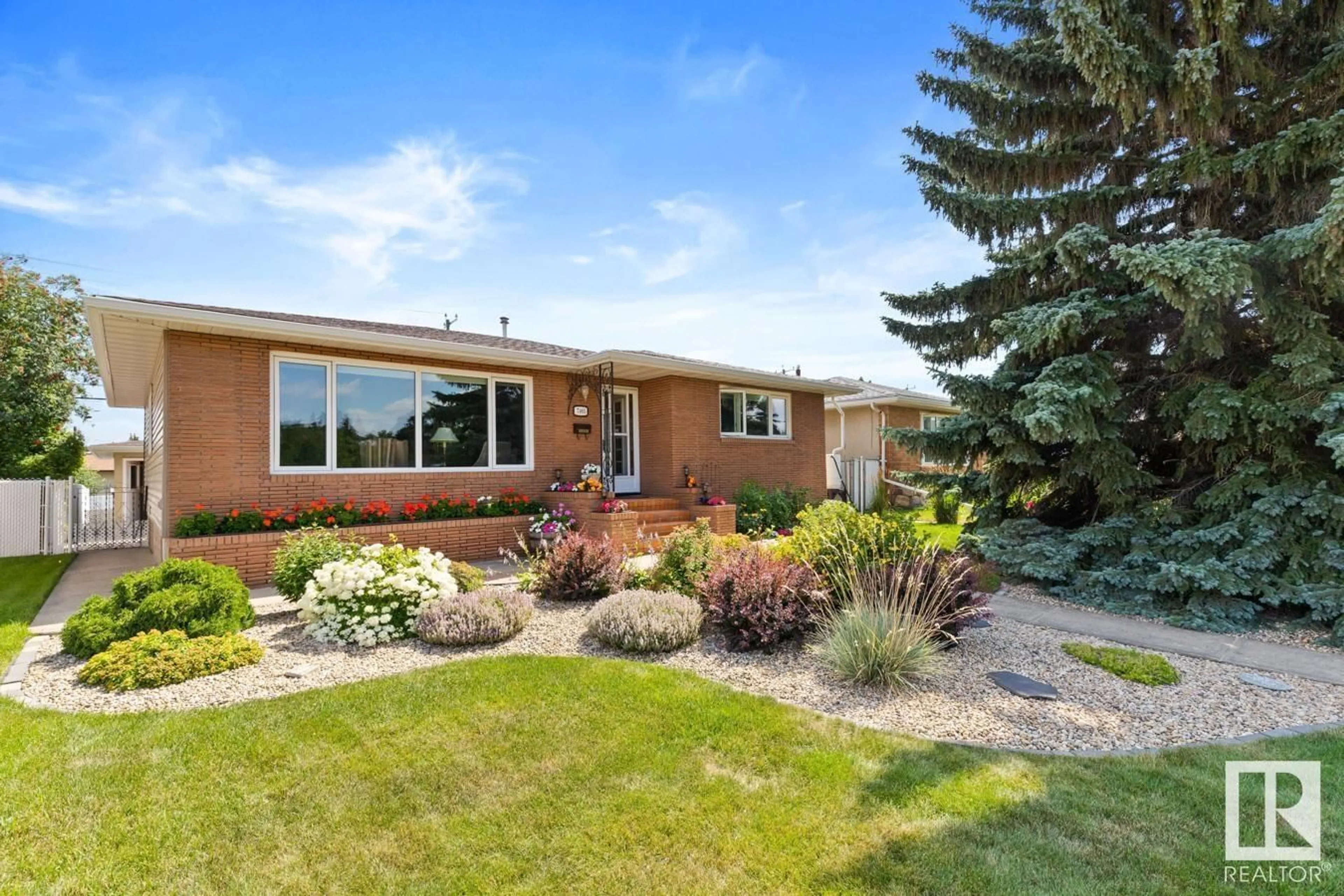 Home with brick exterior material, street for NW - 7405 87 AV, Edmonton Alberta T6B0L8