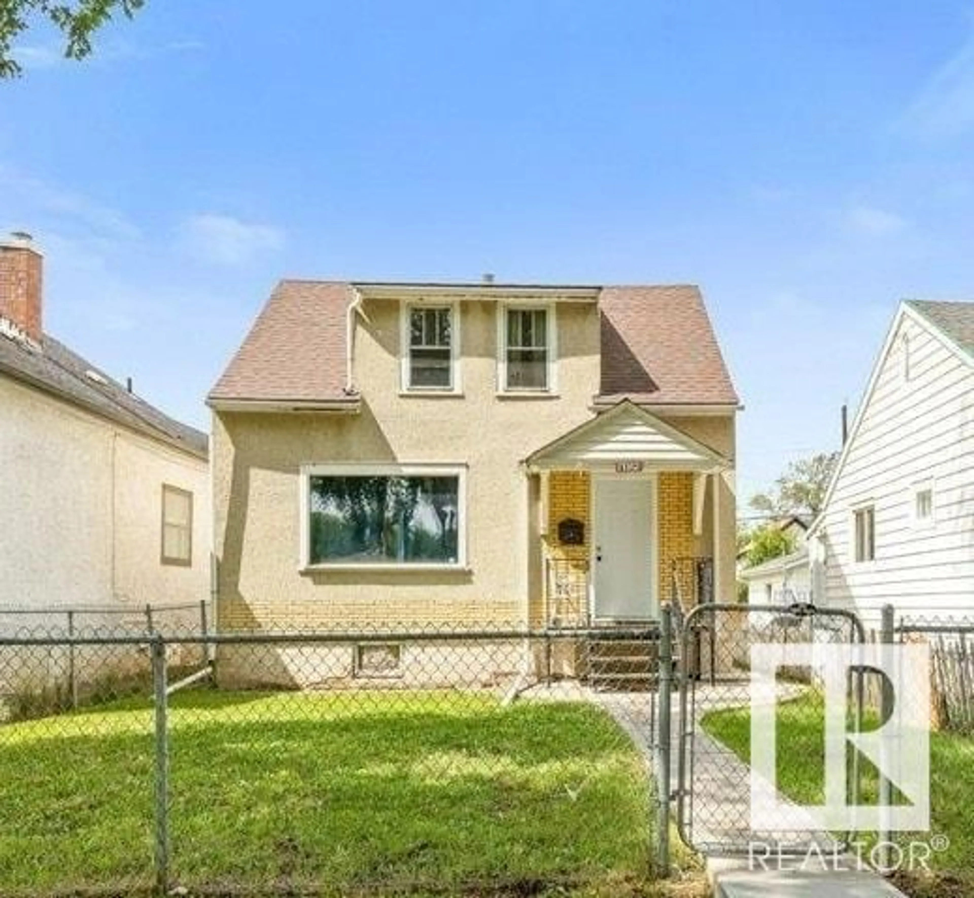 Home with vinyl exterior material, street for 11312 91 ST, Edmonton Alberta T5B4A3