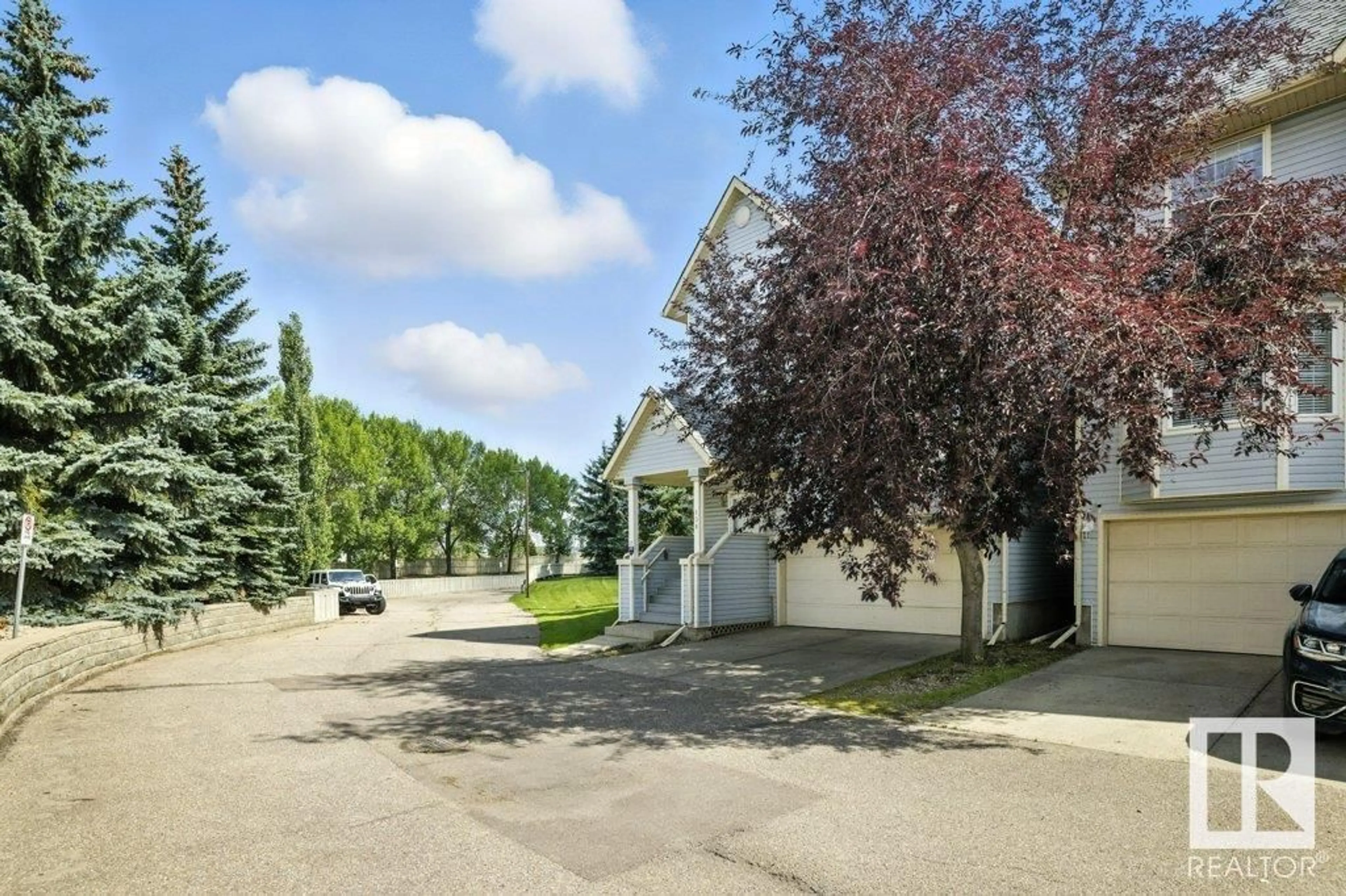 A pic from outside/outdoor area/front of a property/back of a property/a pic from drone, street for 1670 - 138 JAMHA RD, Edmonton Alberta T6L7B3