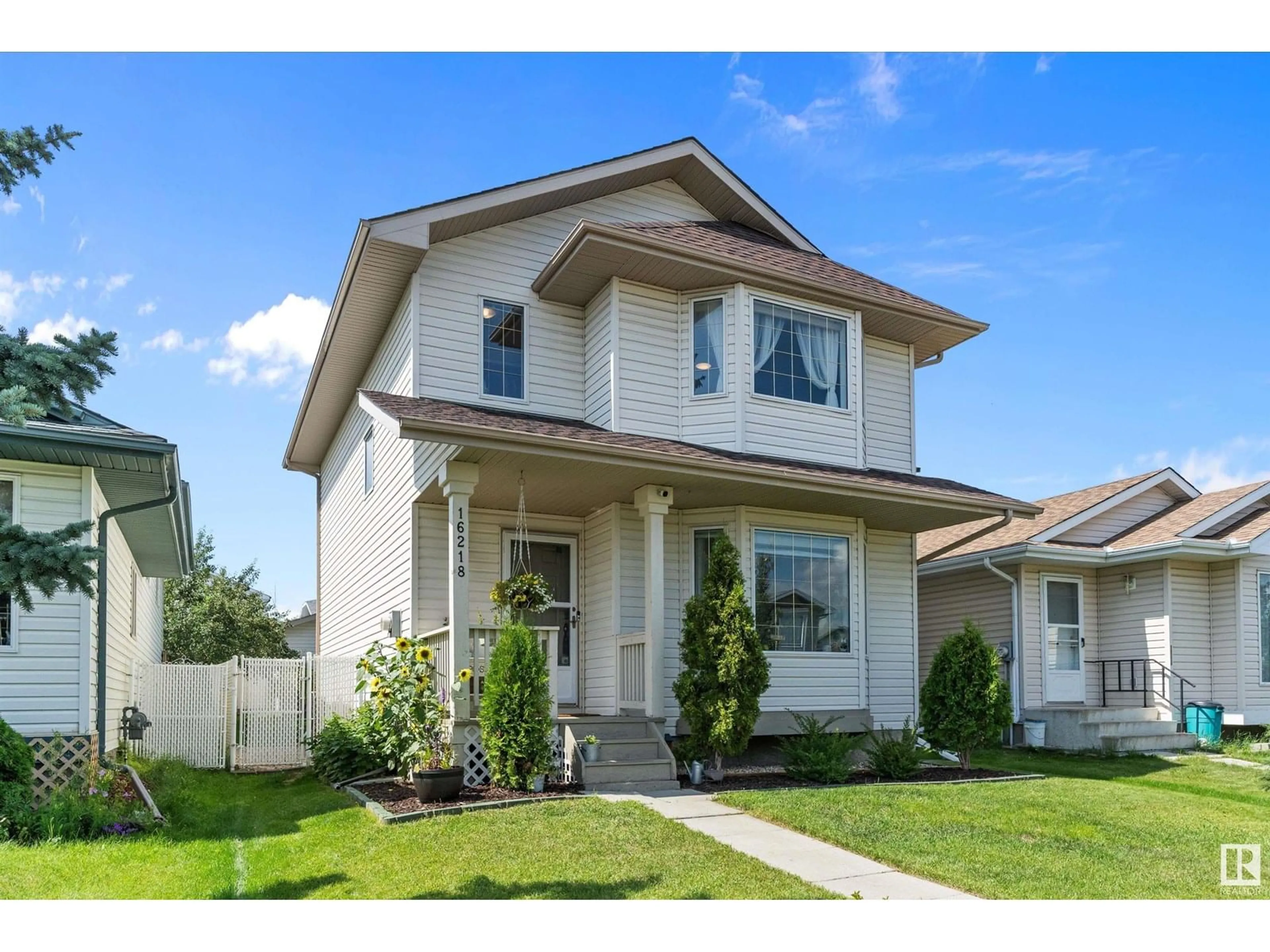 Home with vinyl exterior material, street for 16218 56 ST, Edmonton Alberta T5Y2V1