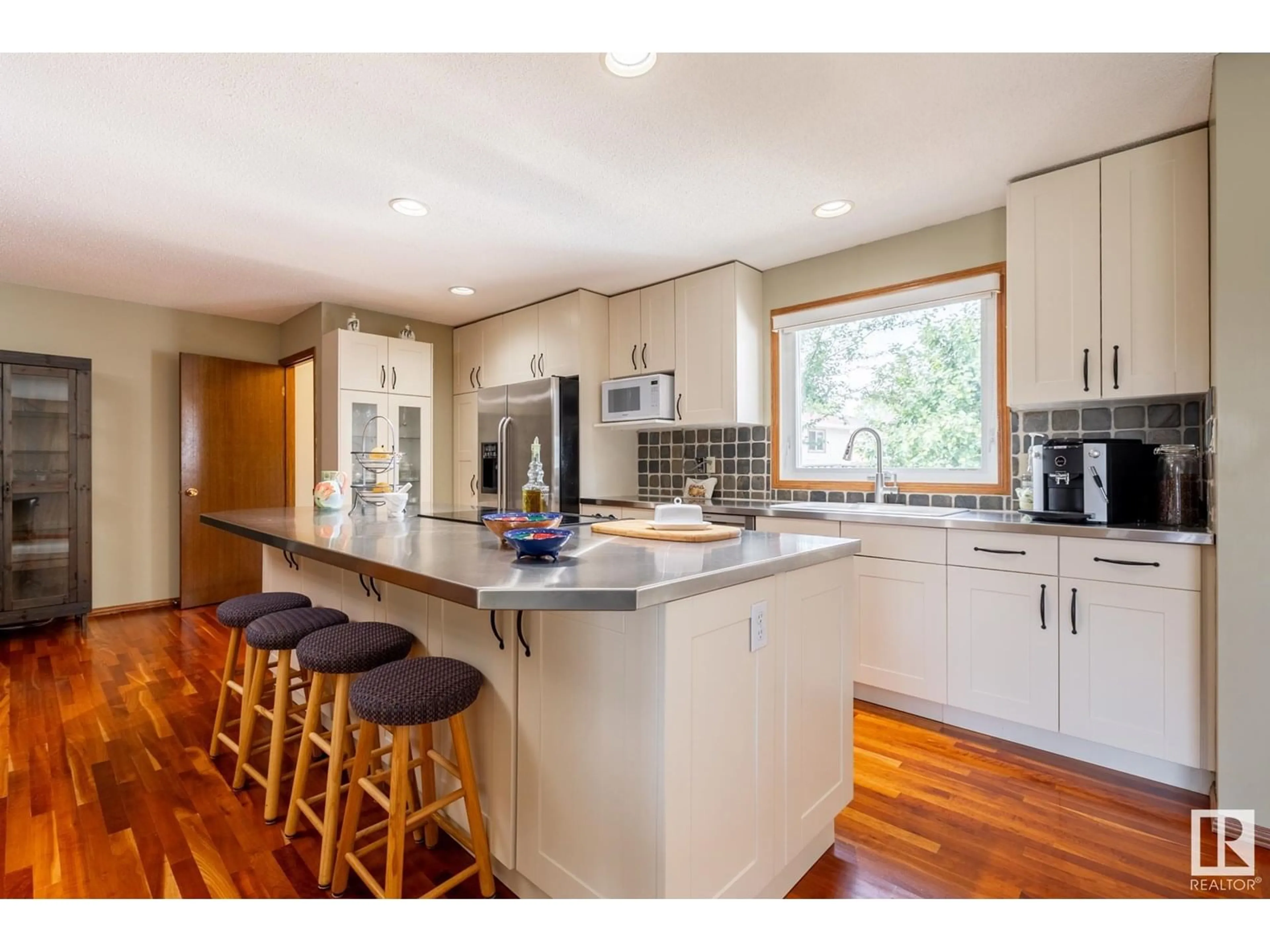 Open concept kitchen, wood/laminate floor for NW - 16408 102 ST, Edmonton Alberta T5X2P3
