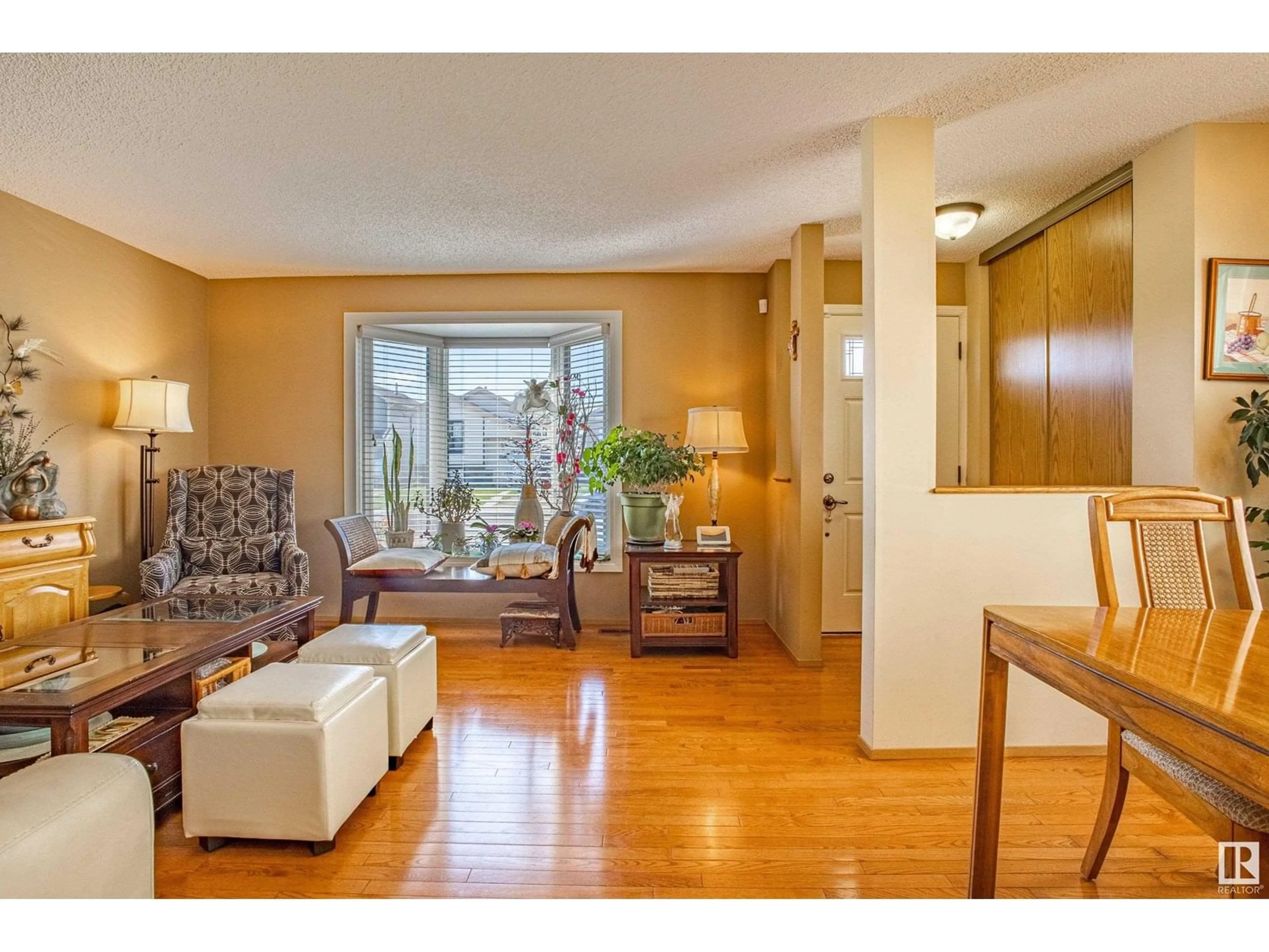 Living room with furniture, wood/laminate floor for 18520 95A AV, Edmonton Alberta T5T4A5